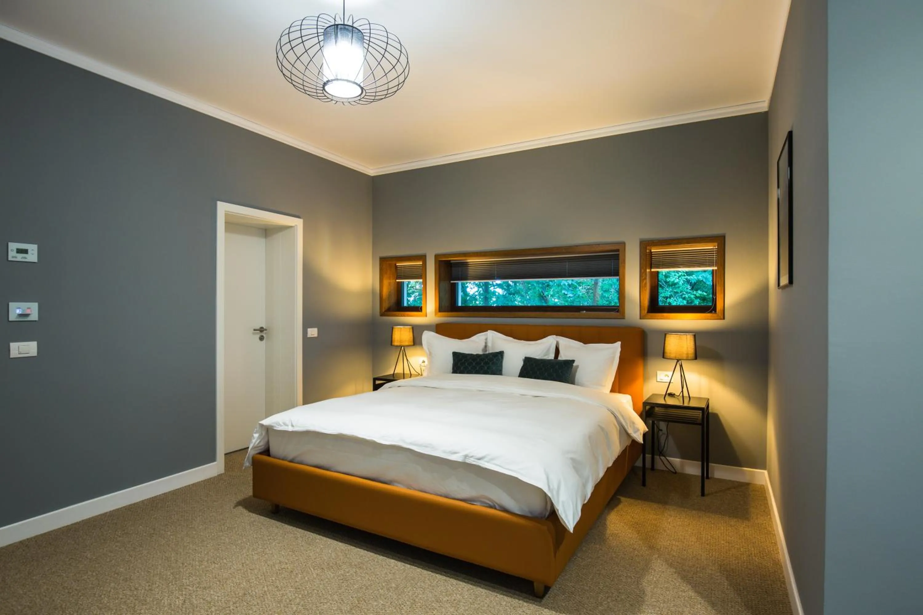 Bed in UpperHouse Suites & More