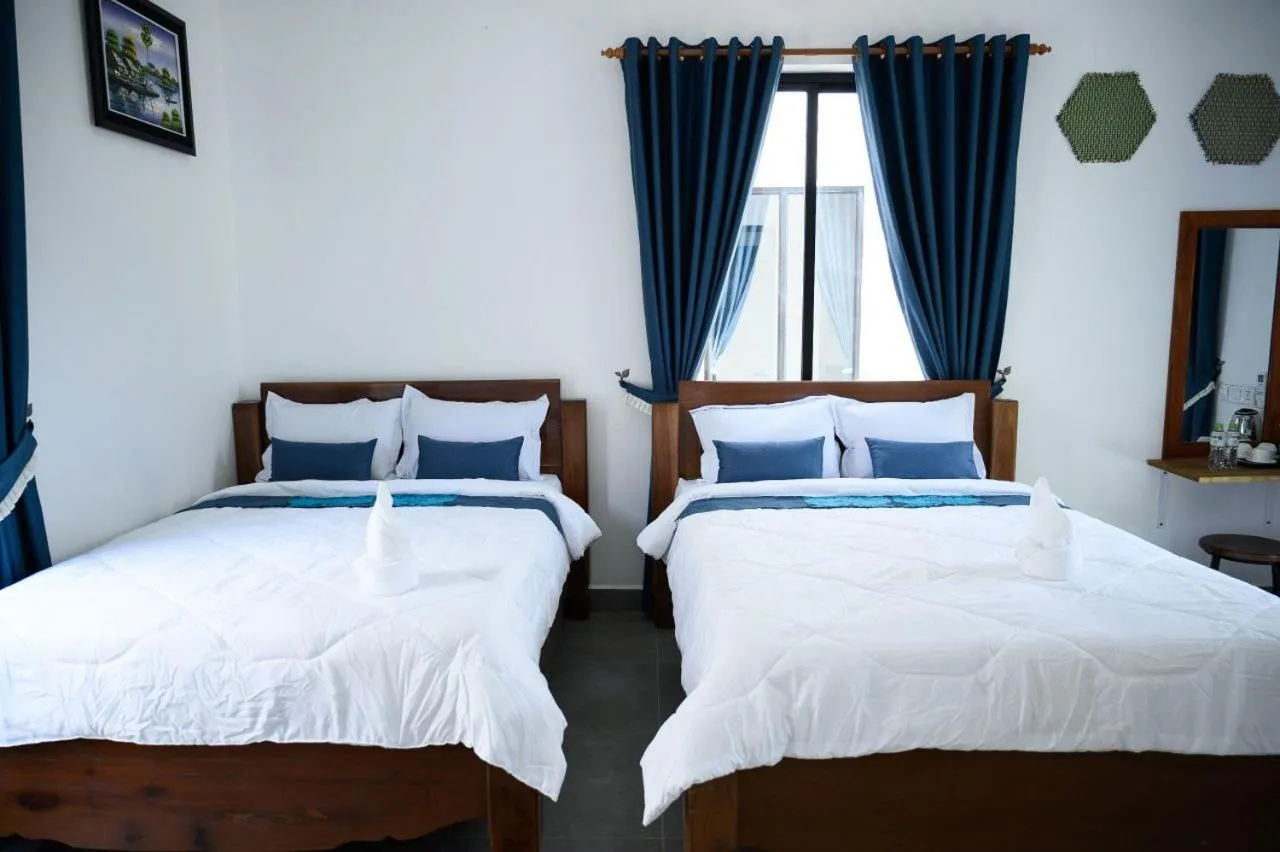 Bed in Kampot River Bungalow by MAMA