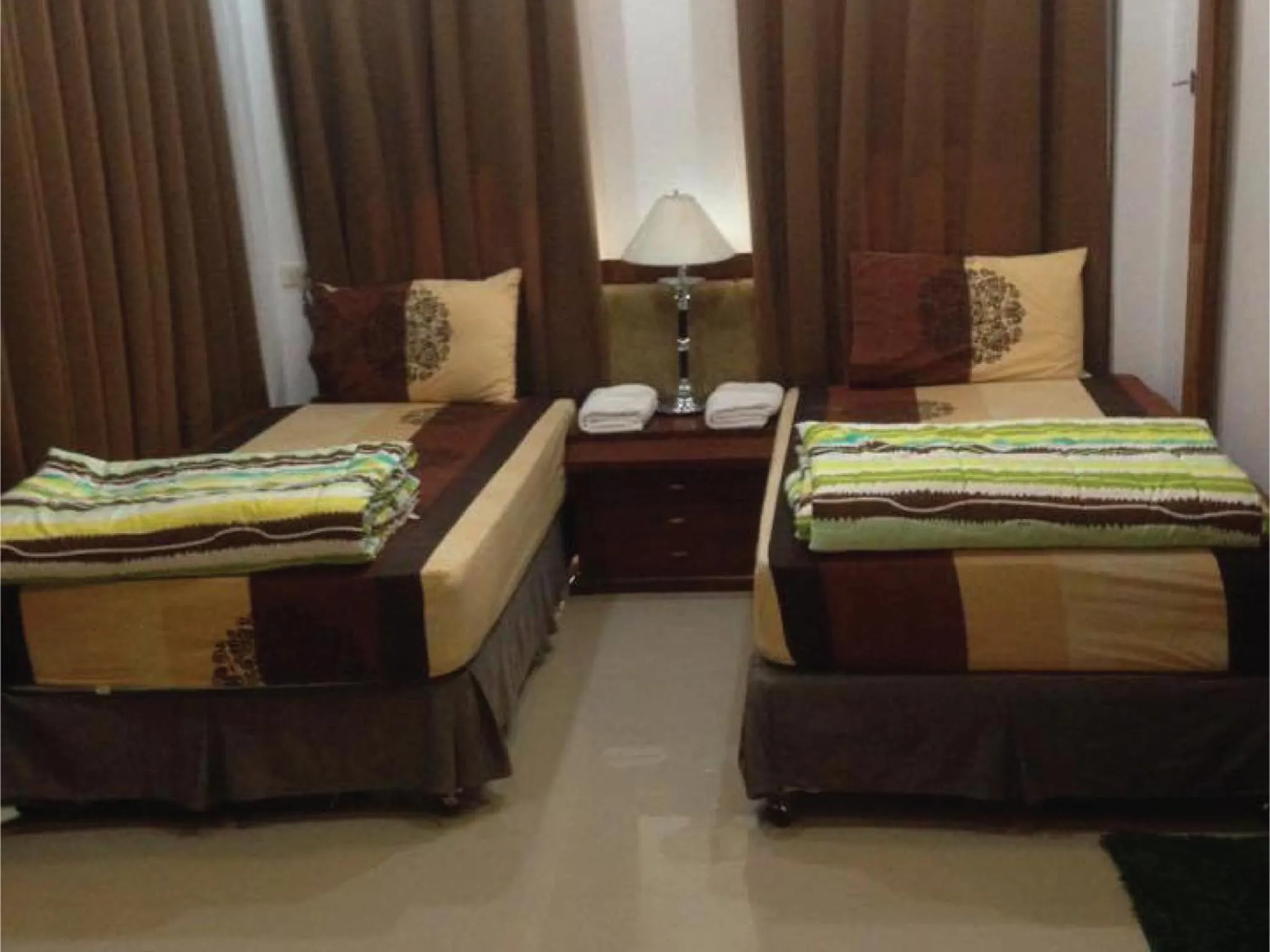 Bed in Damnoen Care Resort