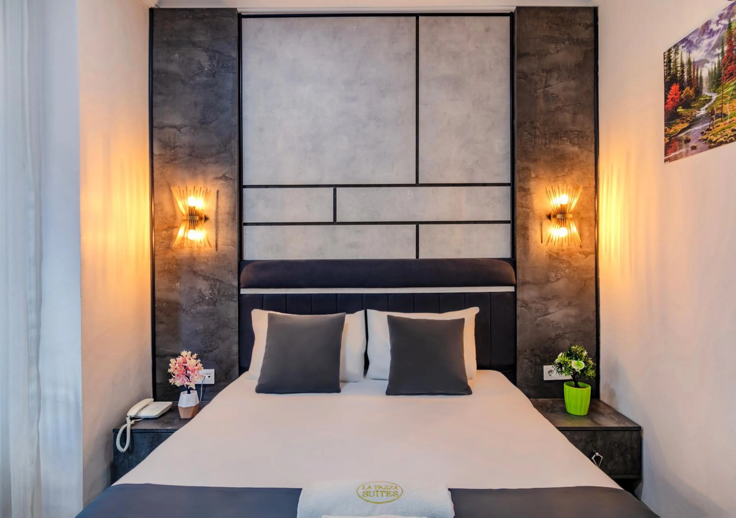 Bed in La Pazza Suites