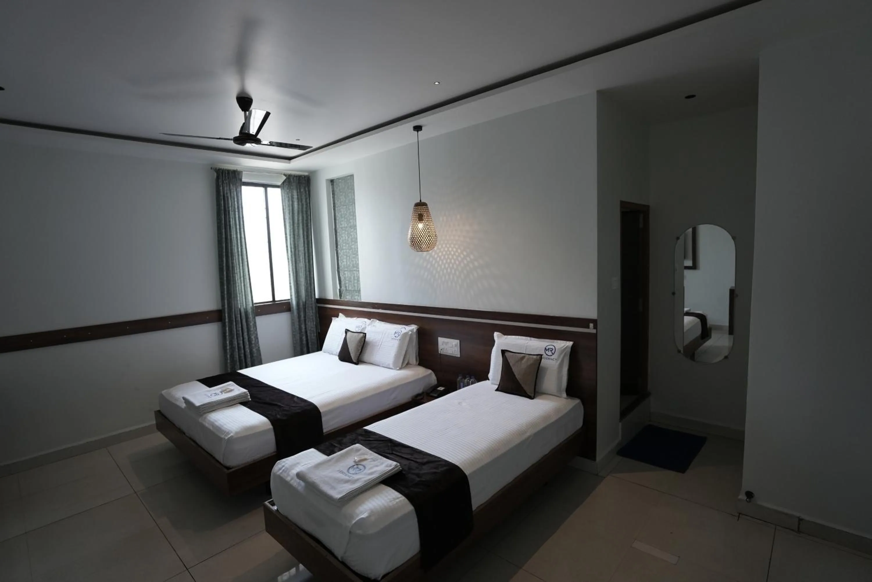 Photo of the whole room, Bed in M R Residency Belagavi