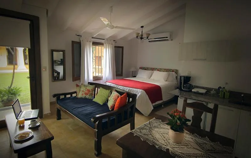 Living room, Bed in La Casona Hotel Boutique