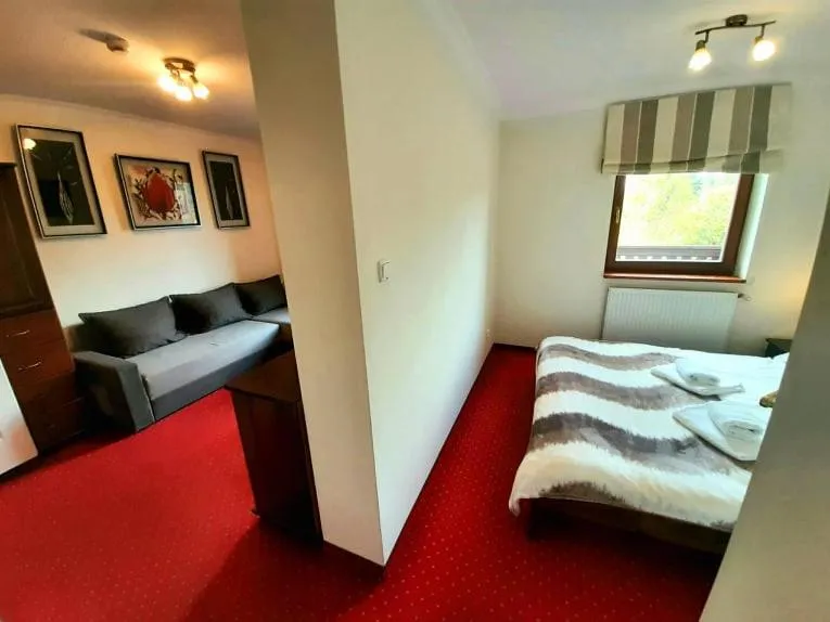 Photo of the whole room, Bed in Dworek Szwajcaria