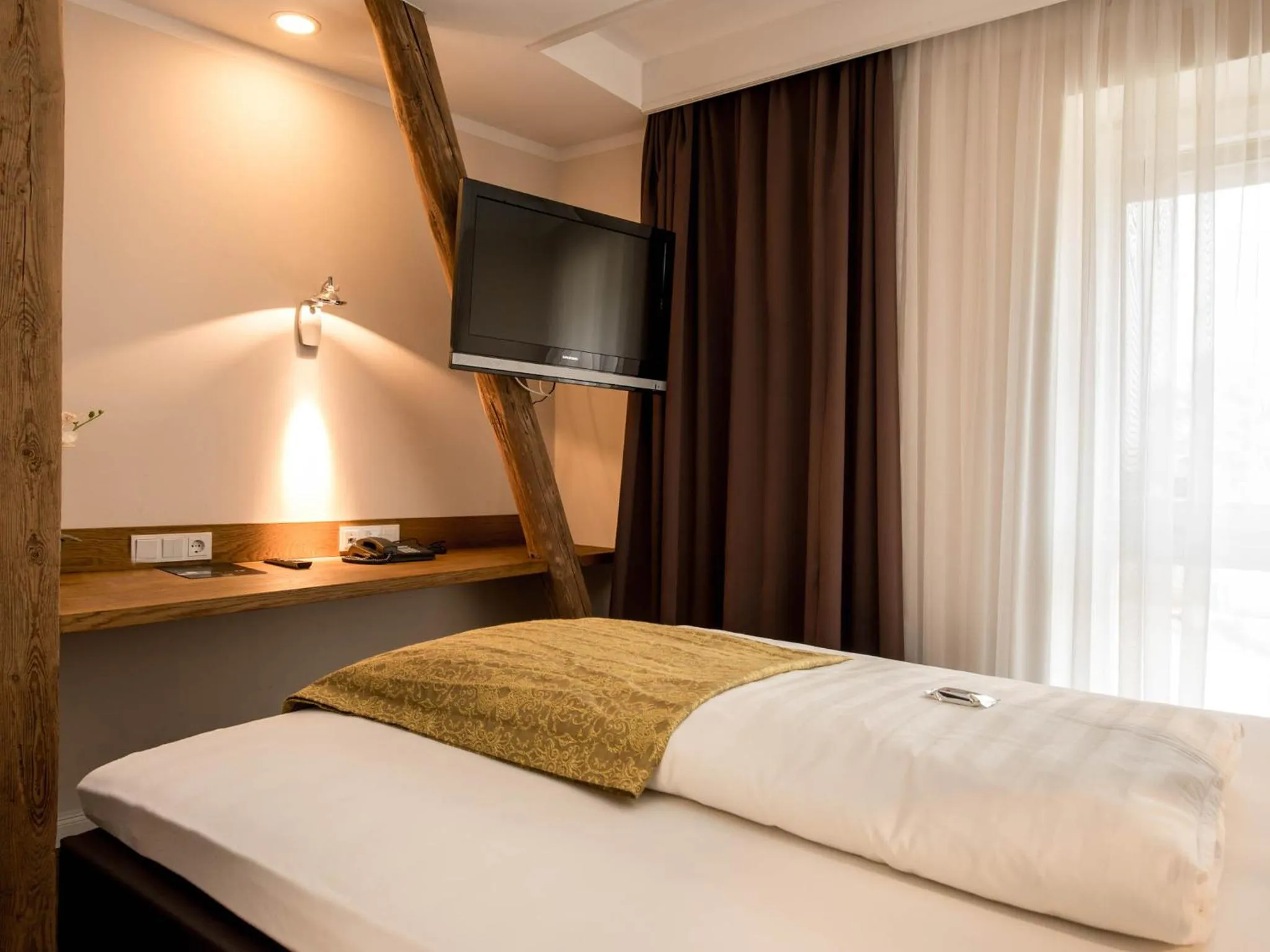 Photo of the whole room, Bed in Die Edelkastanie