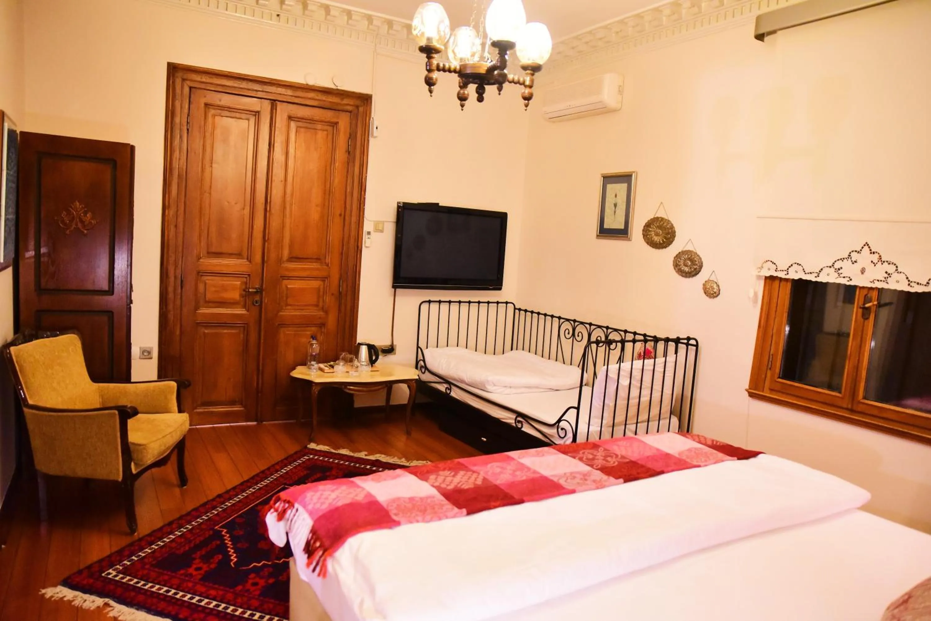 Photo of the whole room, Bed in Ottoman Suites by Sera House