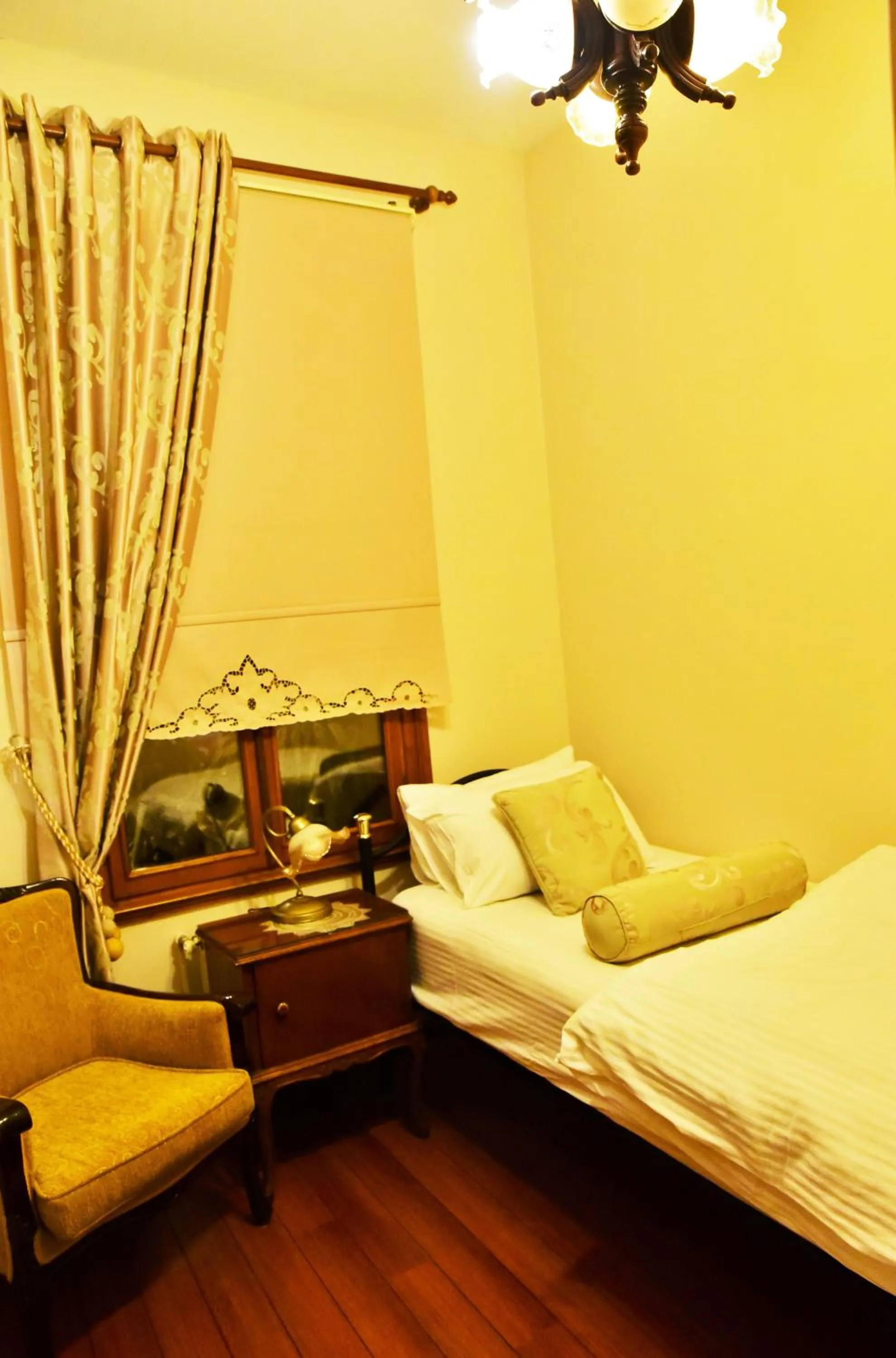 Seating area, Bed in Ottoman Suites by Sera House