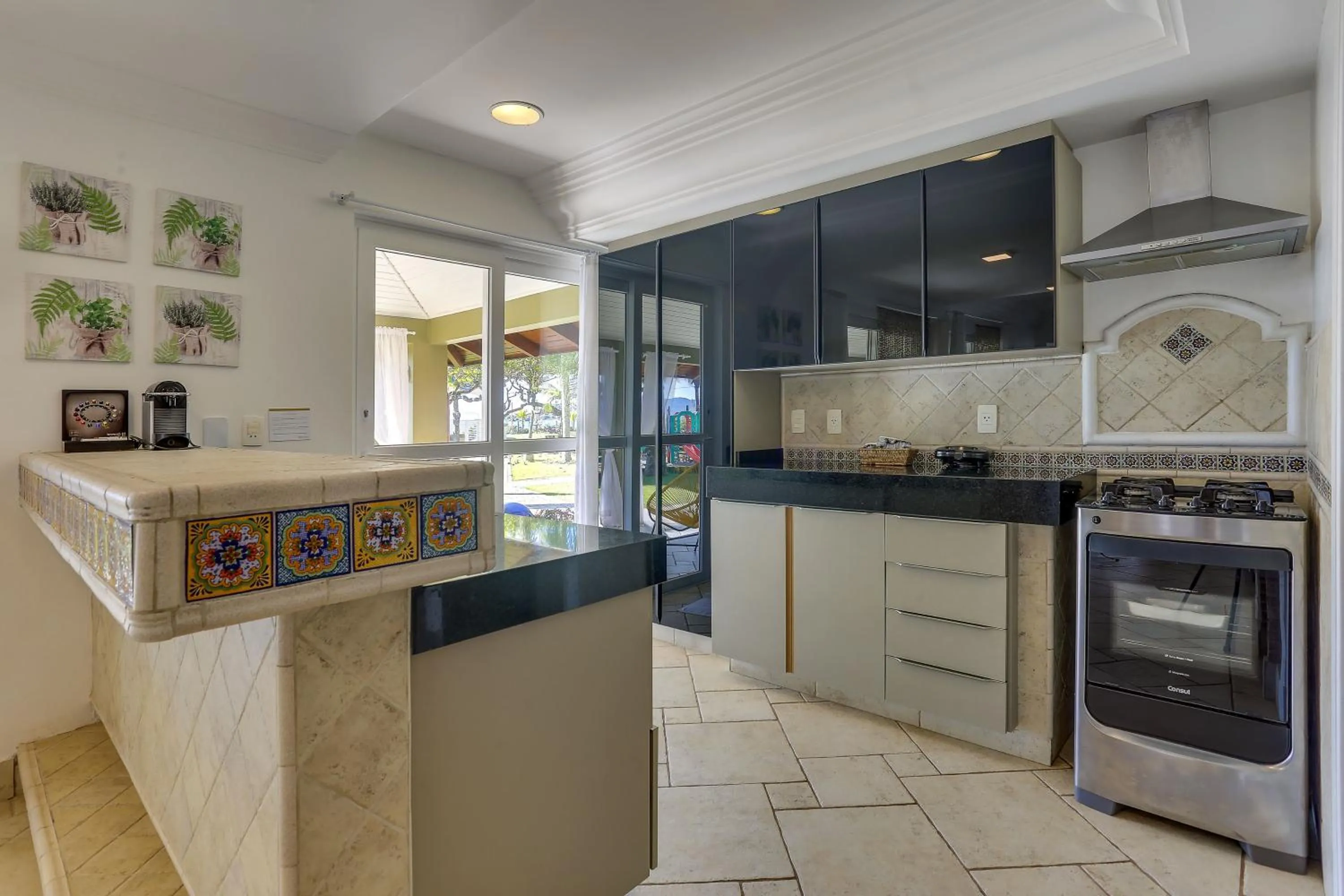 Kitchen or kitchenette in Villas Jurerê Residences