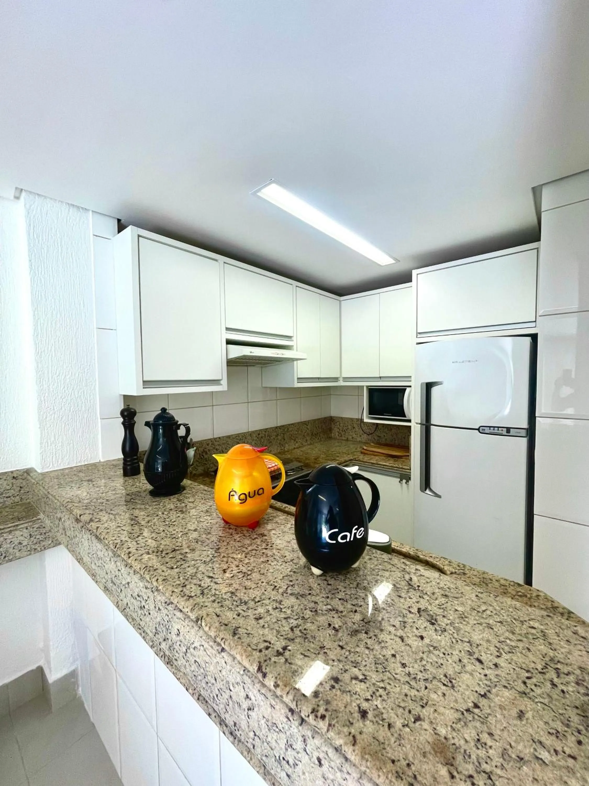Kitchen or kitchenette in Villas Jurerê Residences