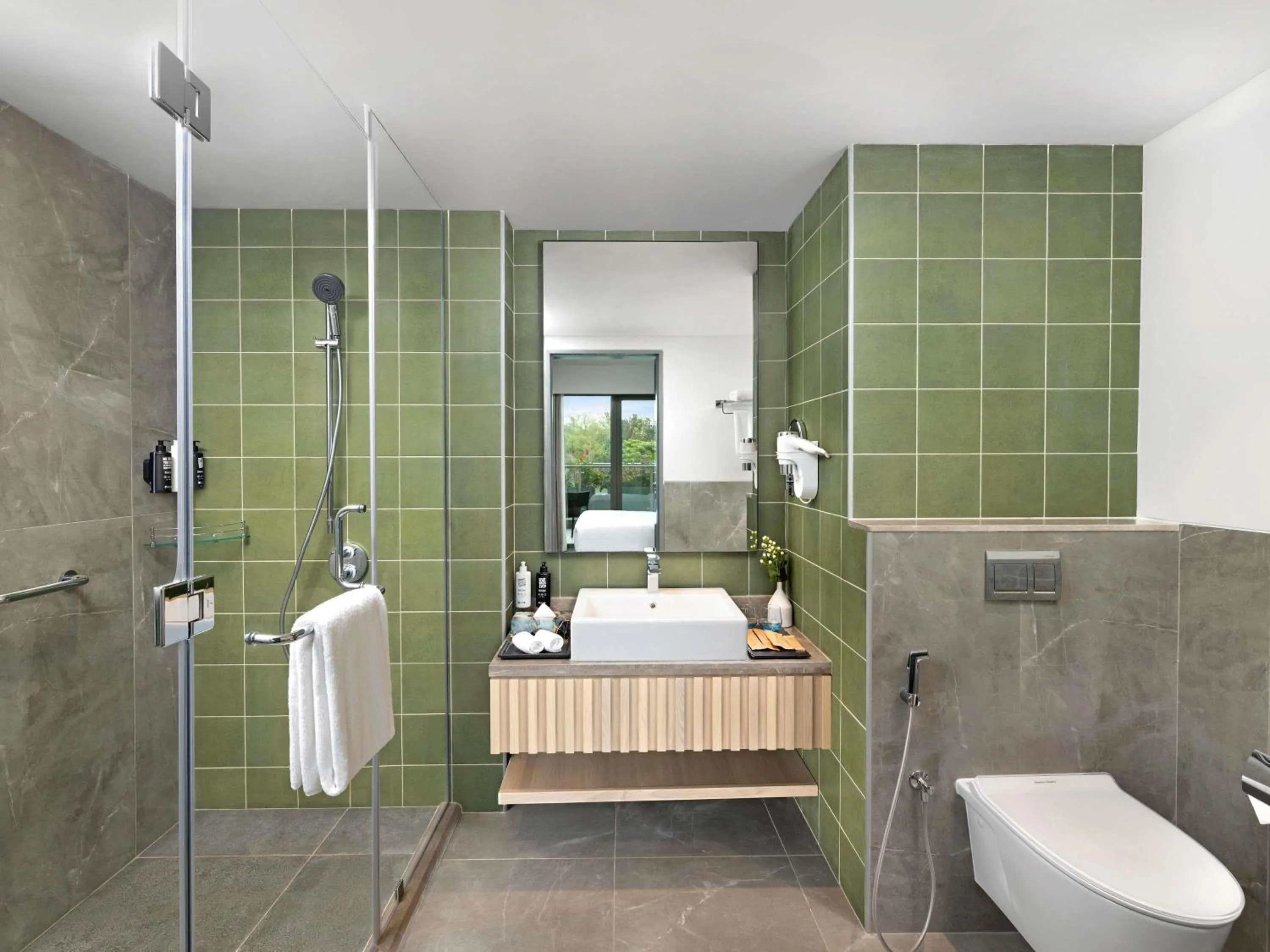 Bedroom in ibis Styles Mysuru