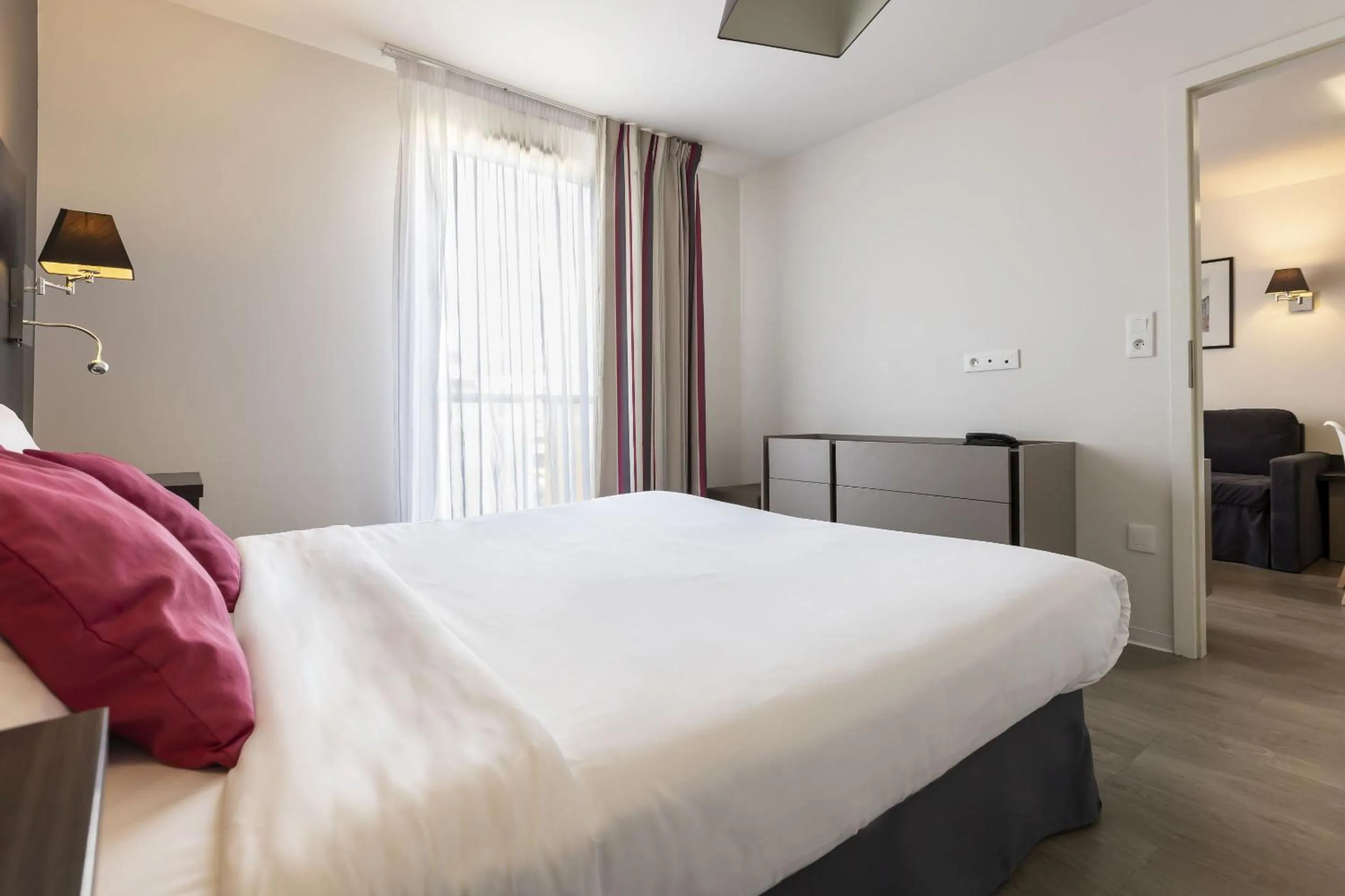 Bedroom, Bed in Appart Hotel Odalys City Colmar La Rose d'Argent