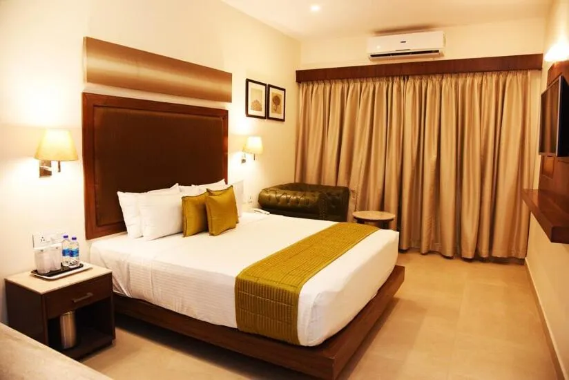 Bed in Hotel Rameswaram Grand