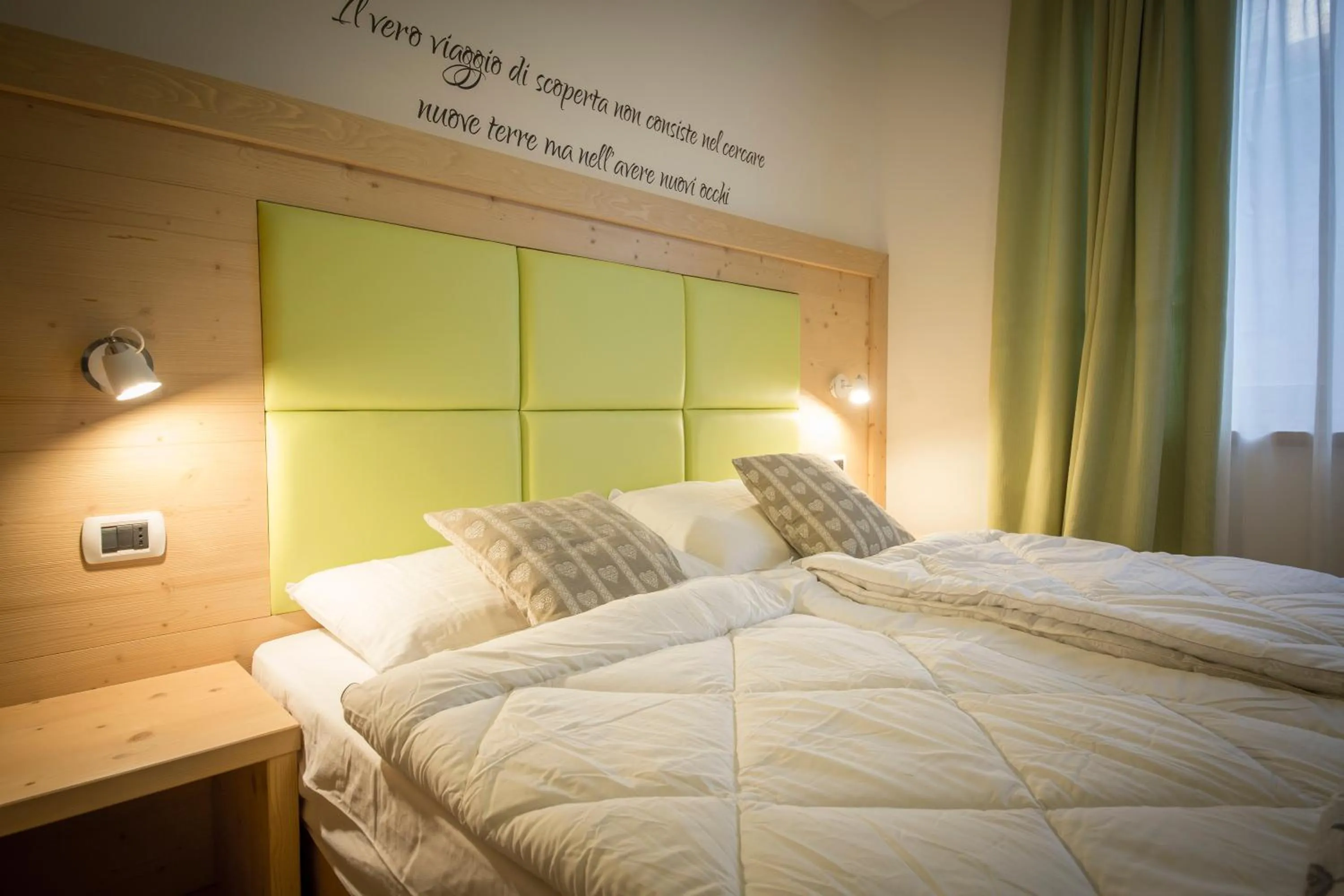 Bed in Aparthotel Dolomites Living&Relax