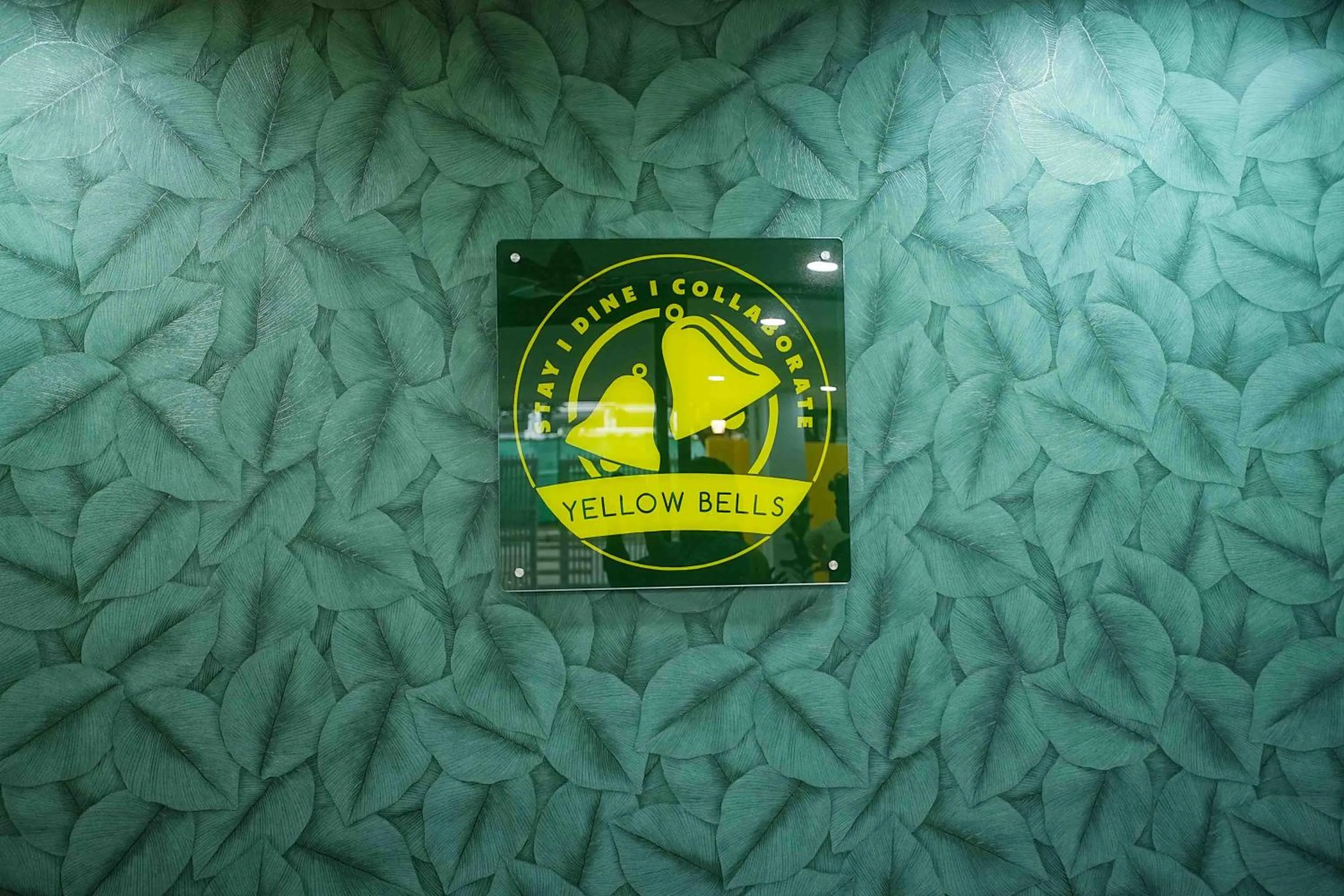 Property logo or sign in Yellow Bells Studios And Suites