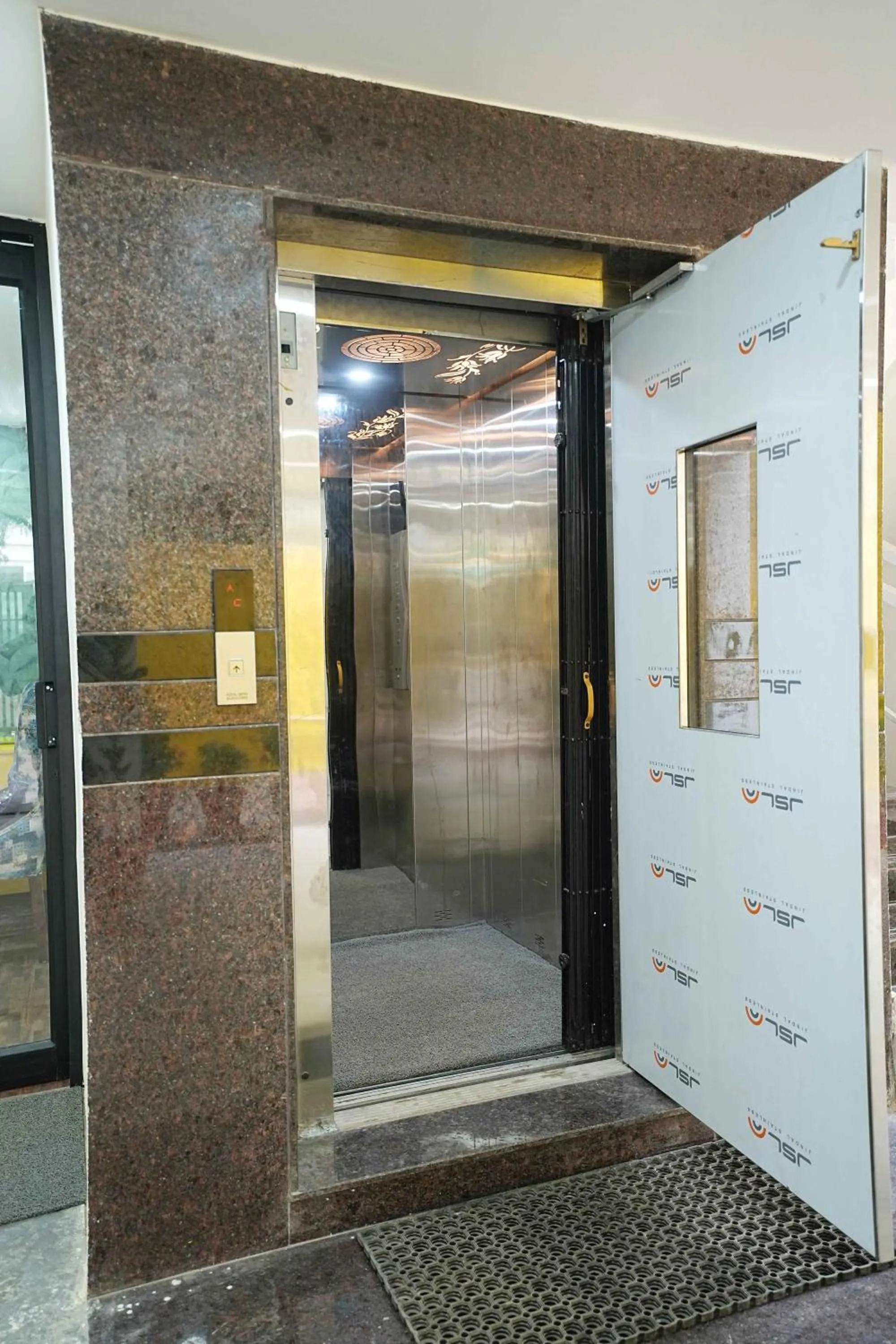 elevator in Yellow Bells Studios And Suites
