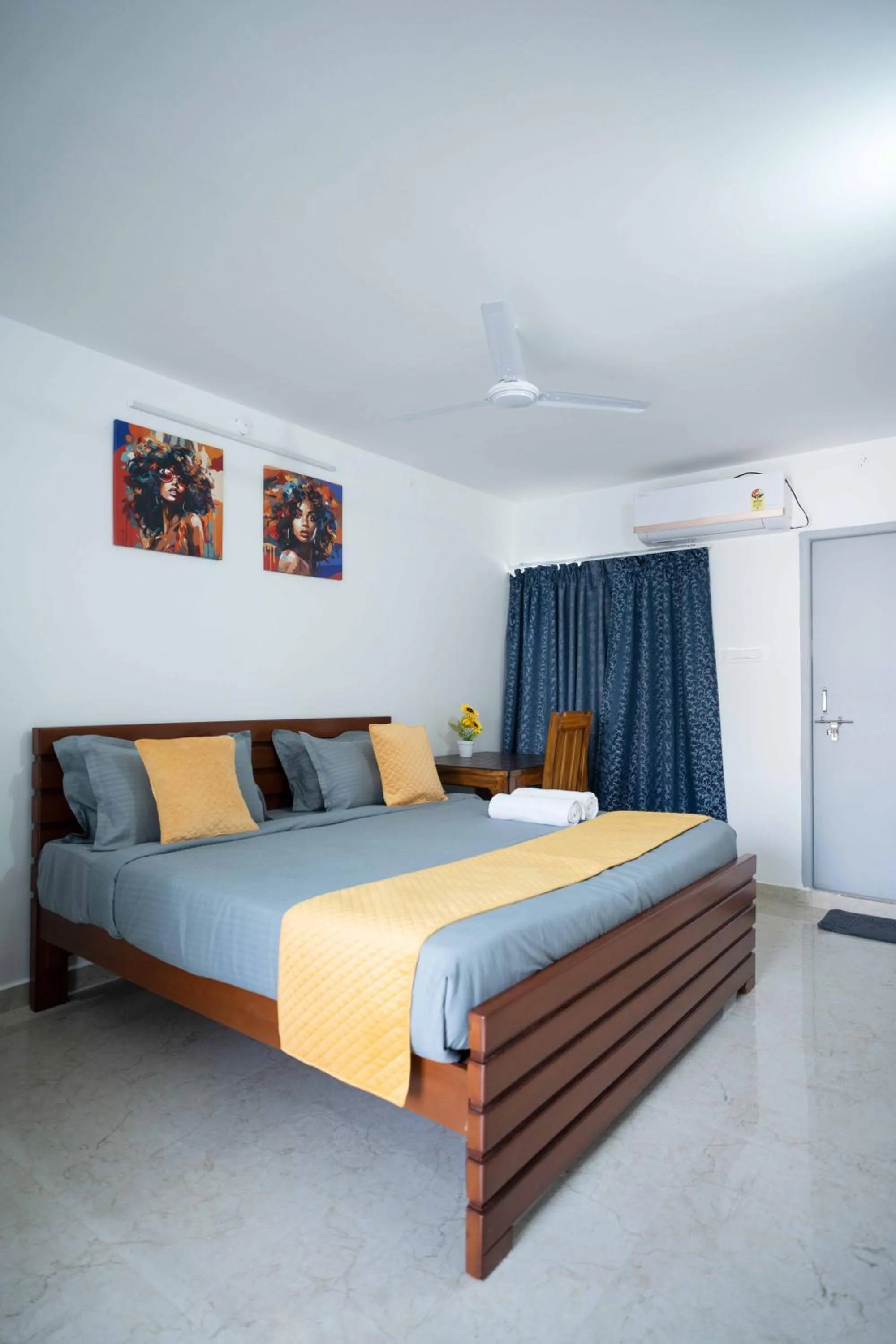 Bed in Yellow Bells Studios And Suites