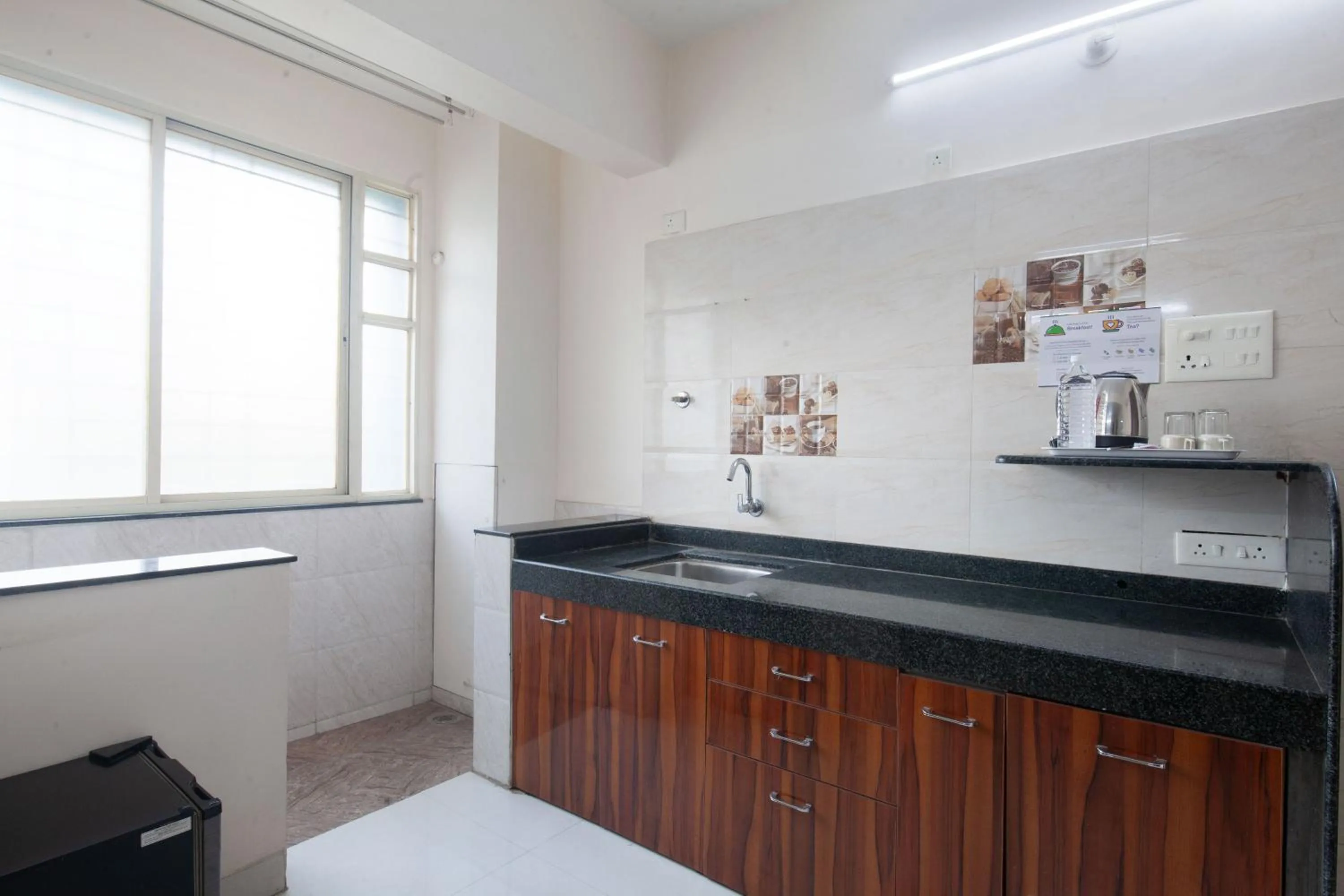Kitchen or kitchenette in Treebo Park View Hadapsar