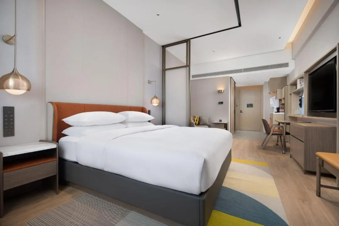 Bed in Home2 Suite by Hilton Yantai Laishan