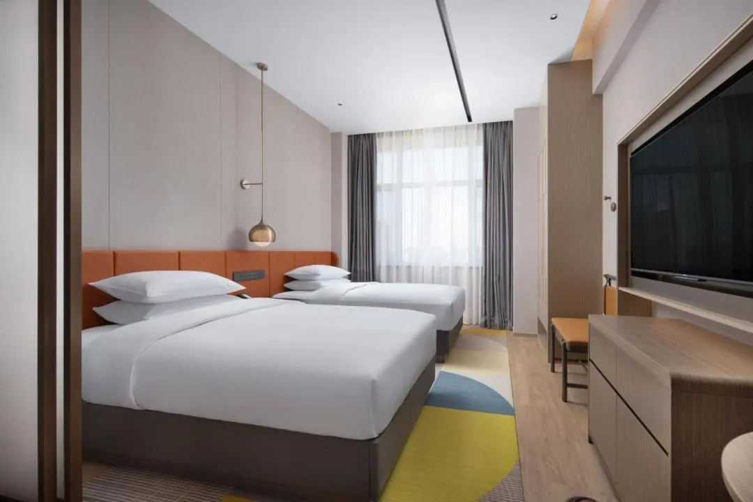 Bed in Home2 Suite by Hilton Yantai Laishan