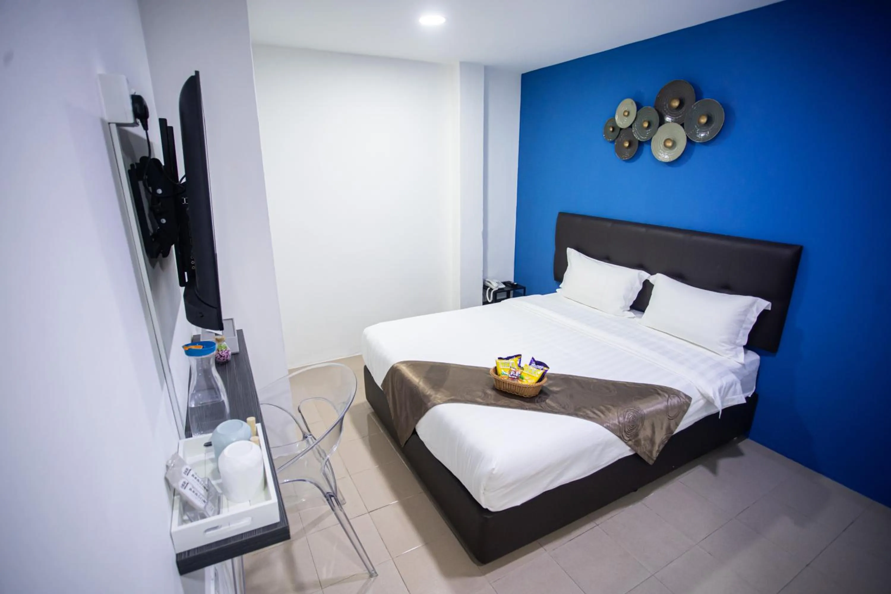 Bed in Rex City Hotel