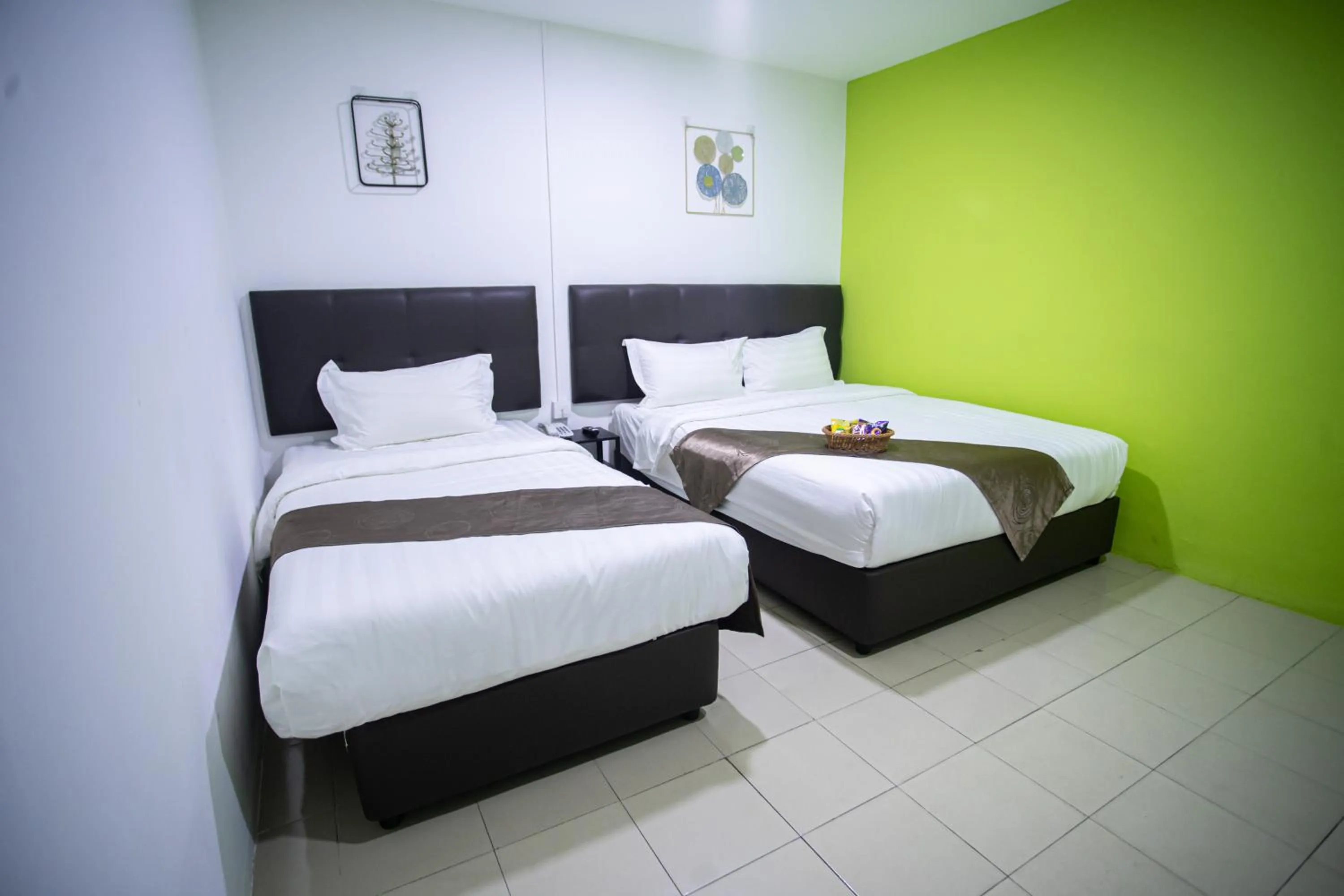 Bed in Rex City Hotel