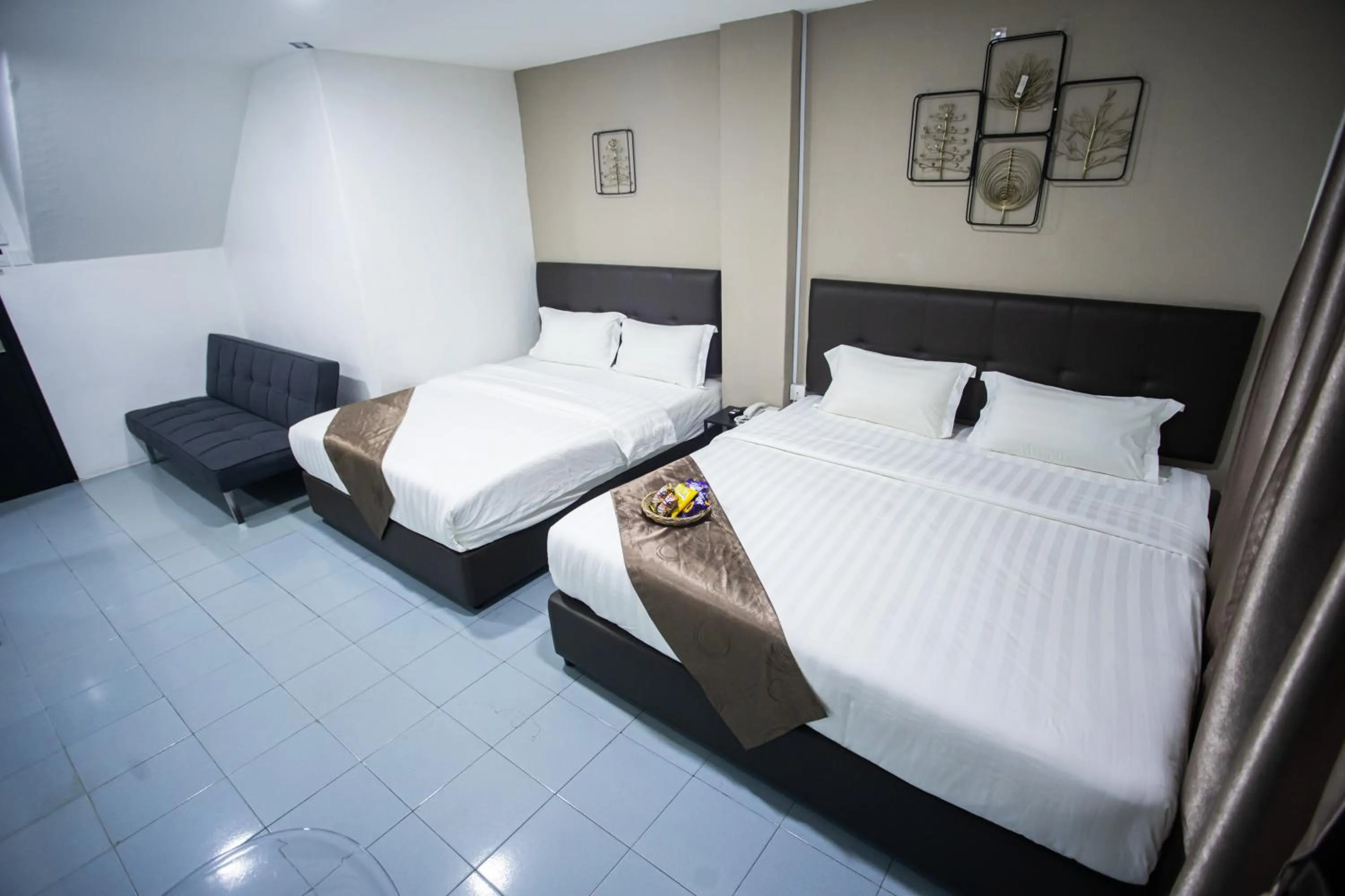 Bed in Rex City Hotel