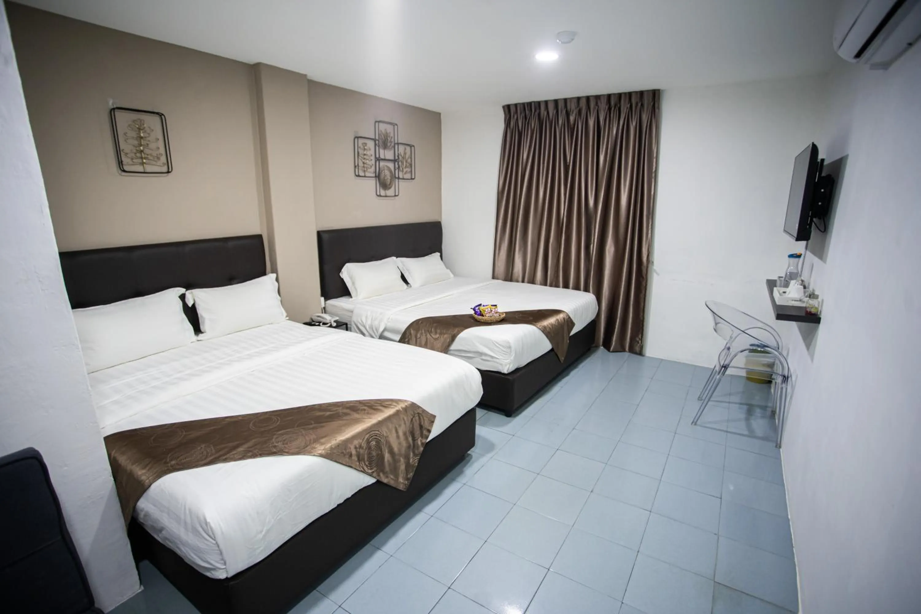 Bed in Rex City Hotel