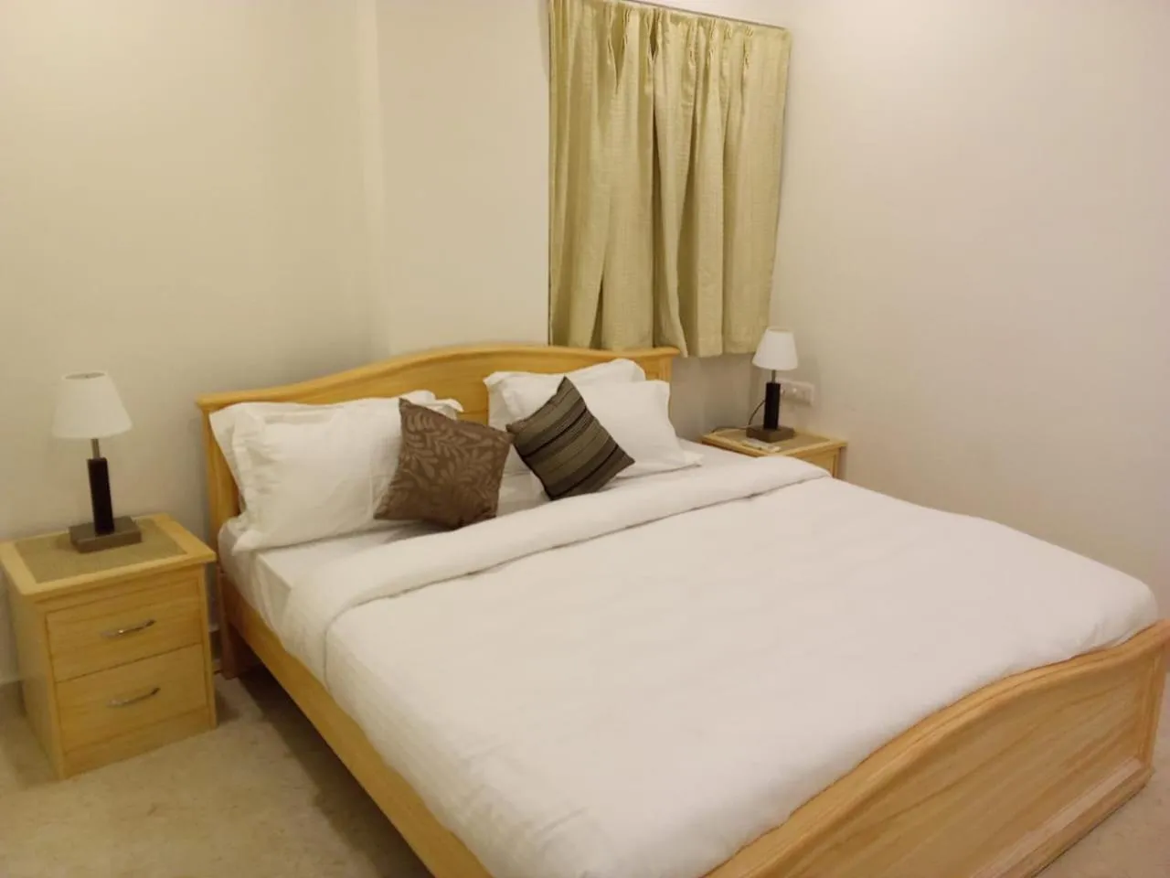 Bed in Enkay Service Apartments