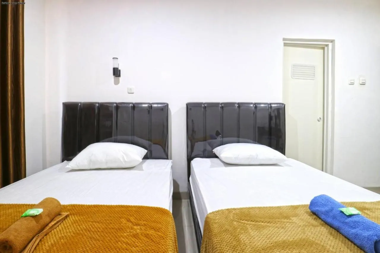 Bed in Saloka Guest House & Residence