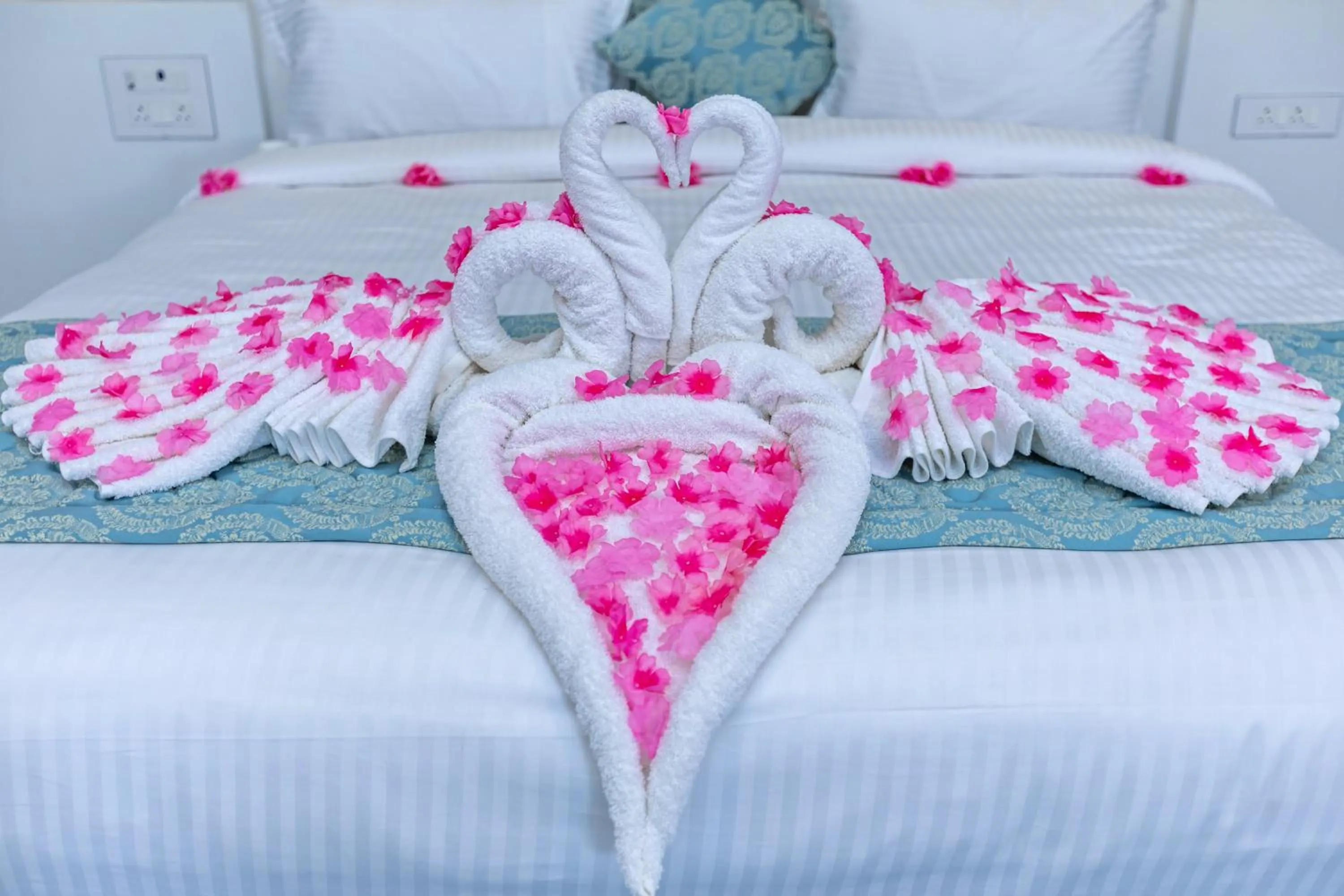 towels, Bed in T Resort with Swimming Pool