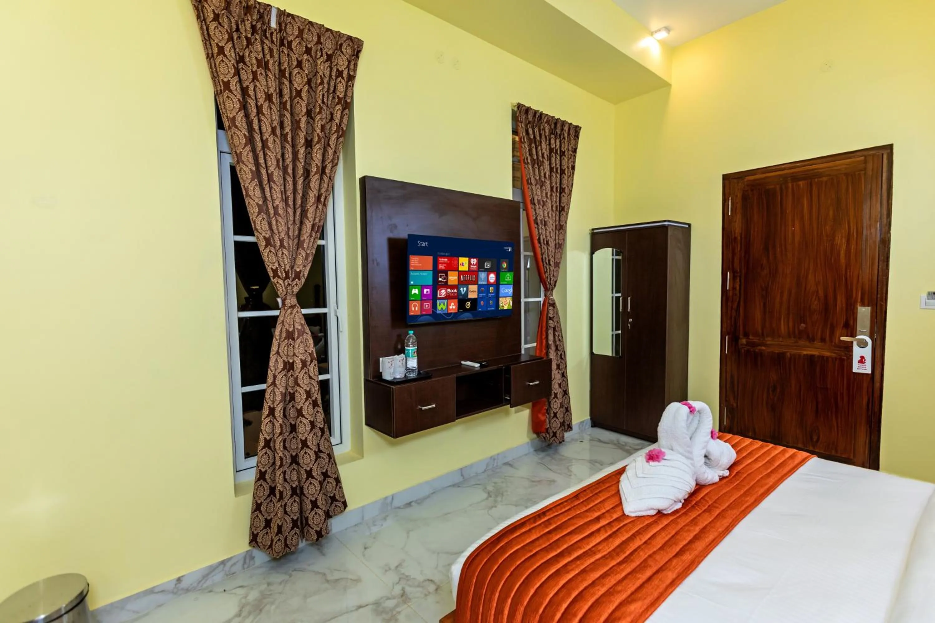 towels, Bed in T Resort with Swimming Pool