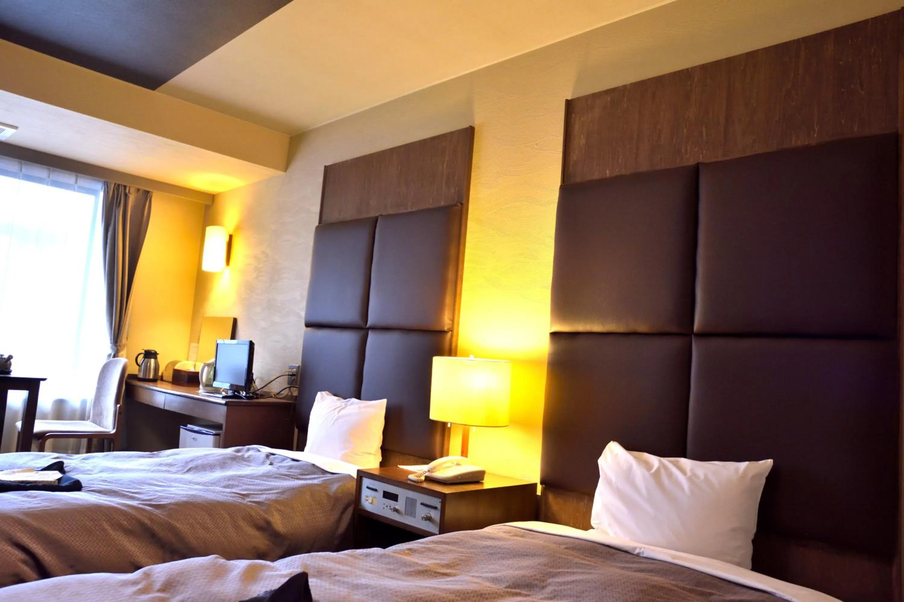 Bed in こんぴら温泉 貸切湯の宿 ことね