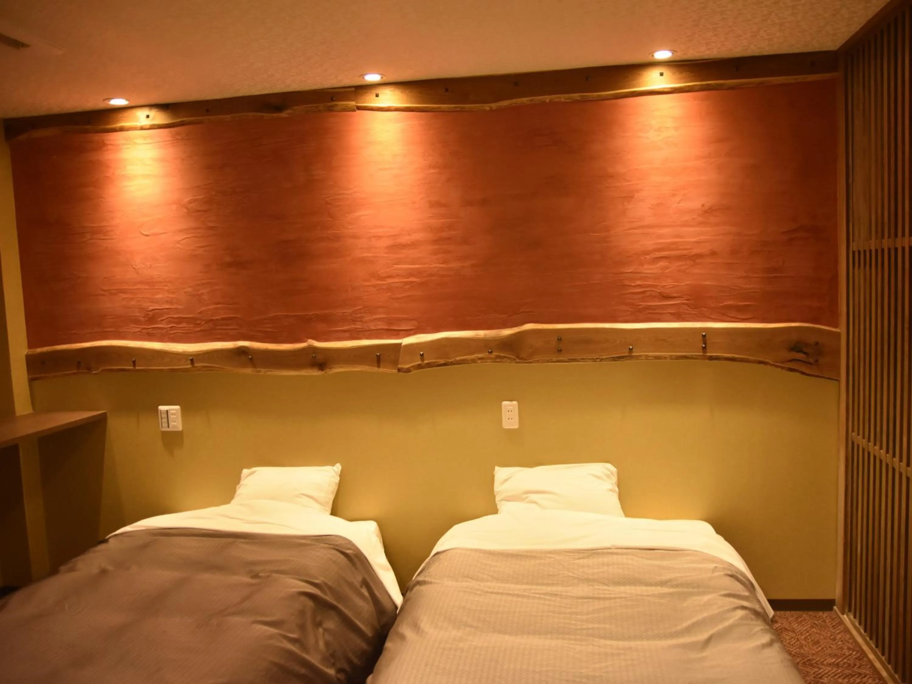 Bed in こんぴら温泉 貸切湯の宿 ことね