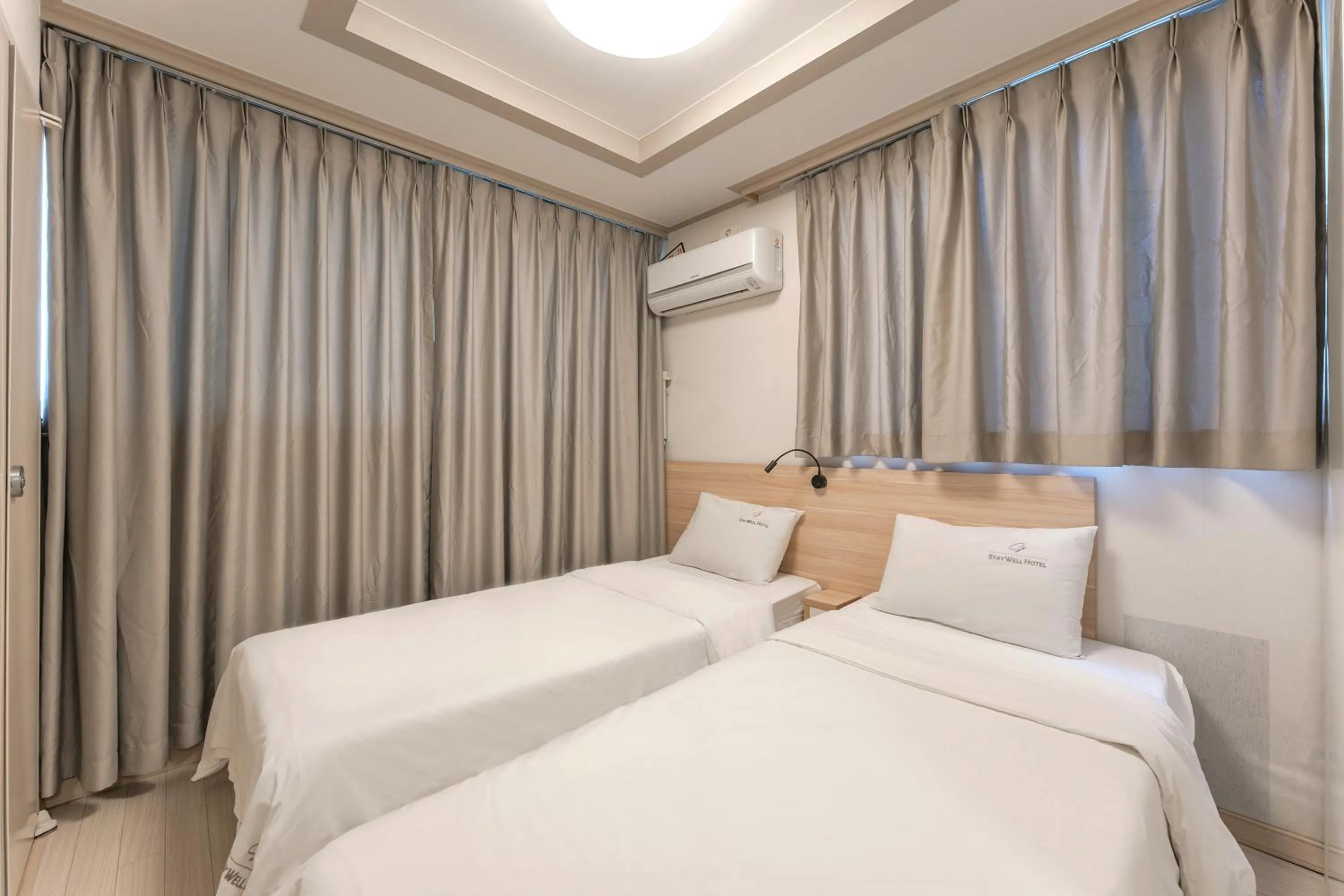 Bed in Staywell Hotel