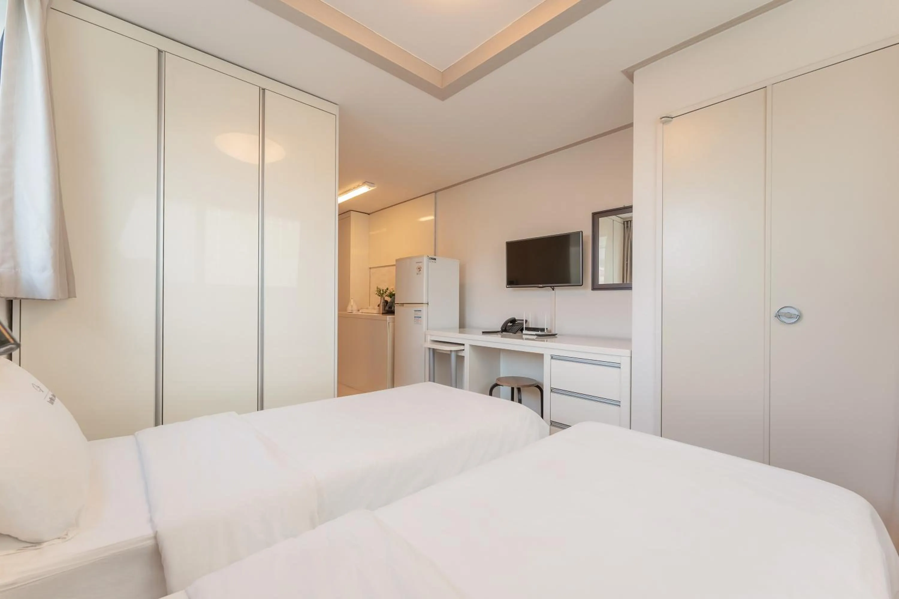 Bed in Staywell Hotel