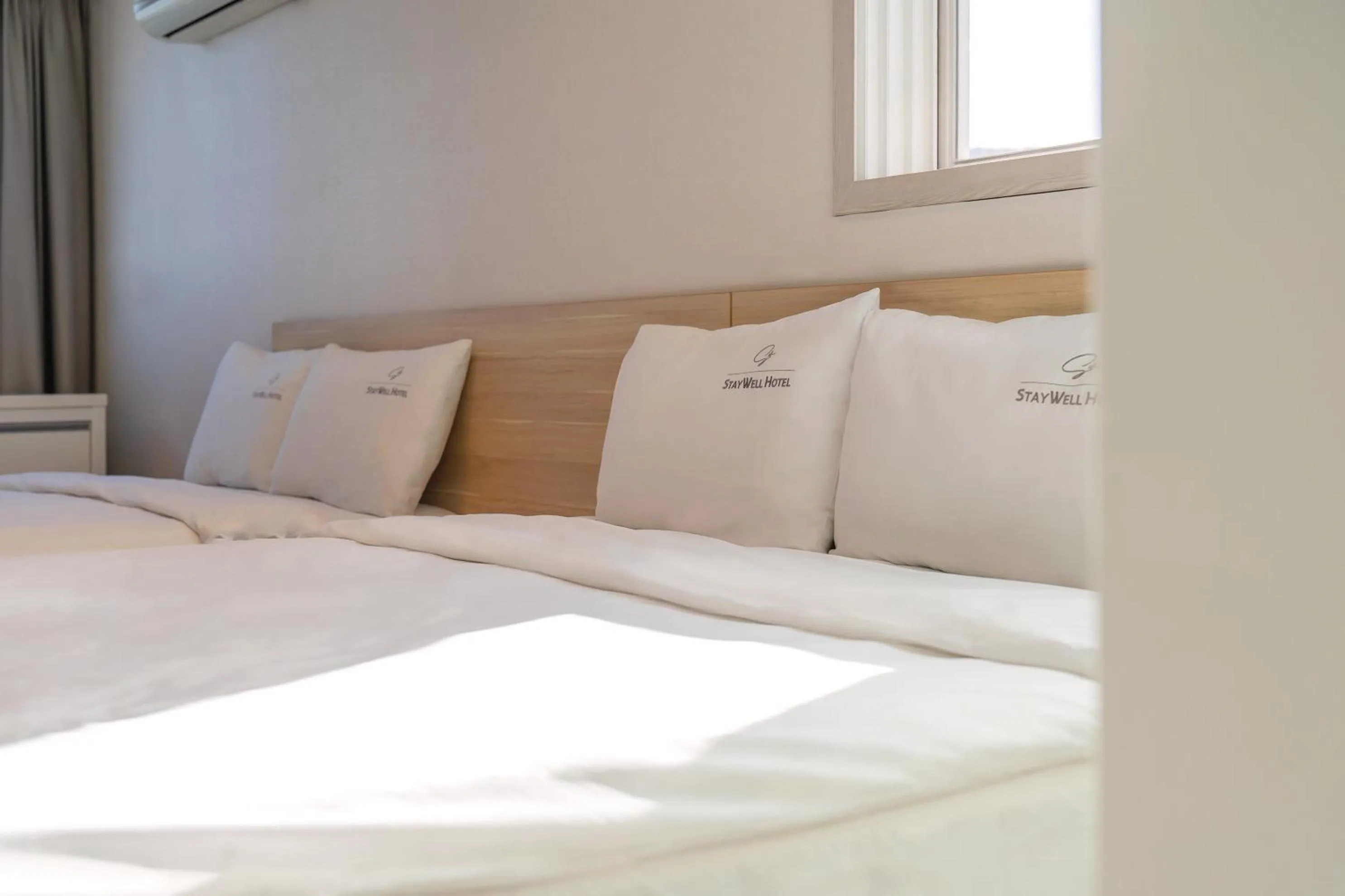 Bed in Staywell Hotel