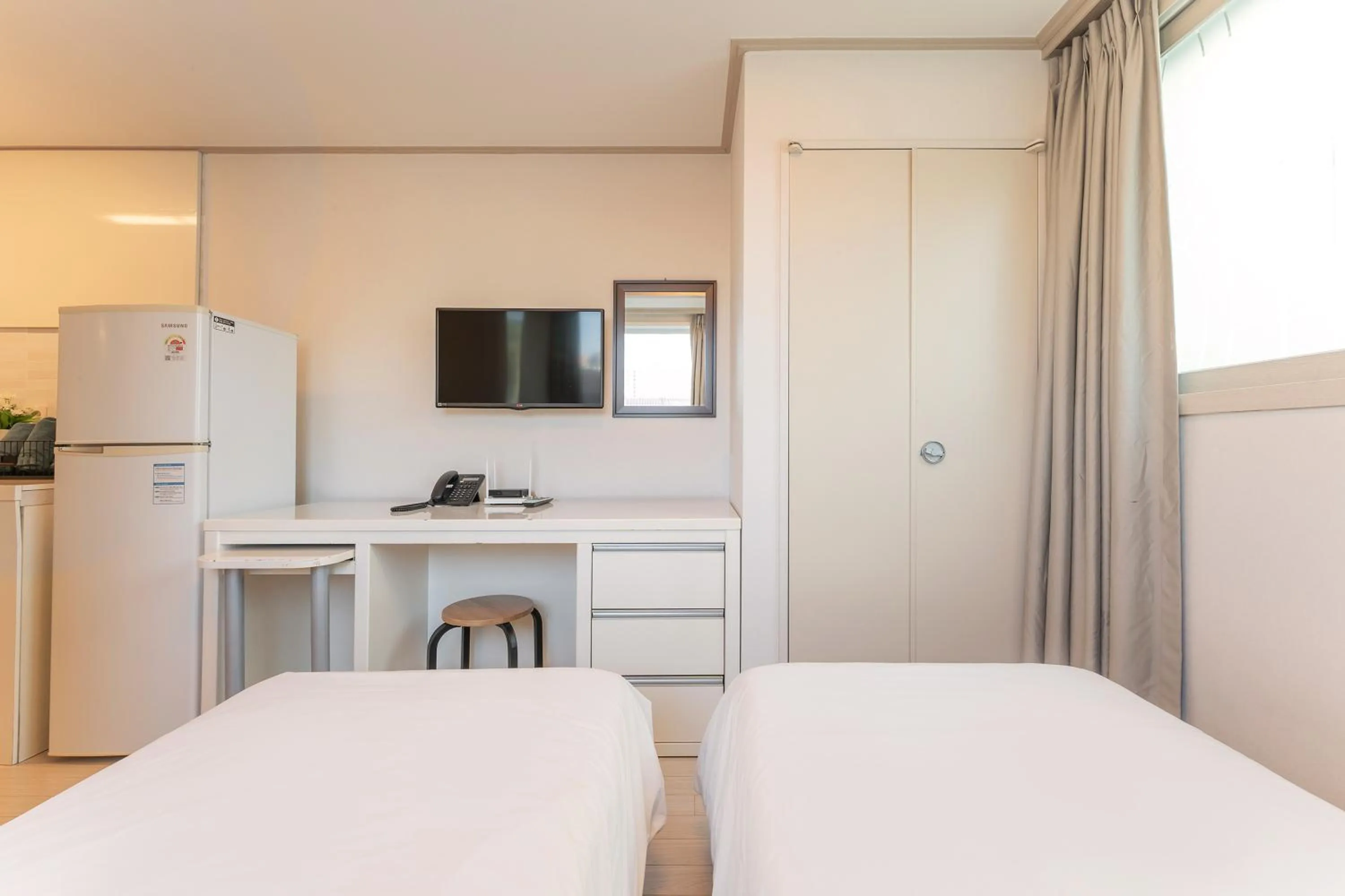 Bed in Staywell Hotel