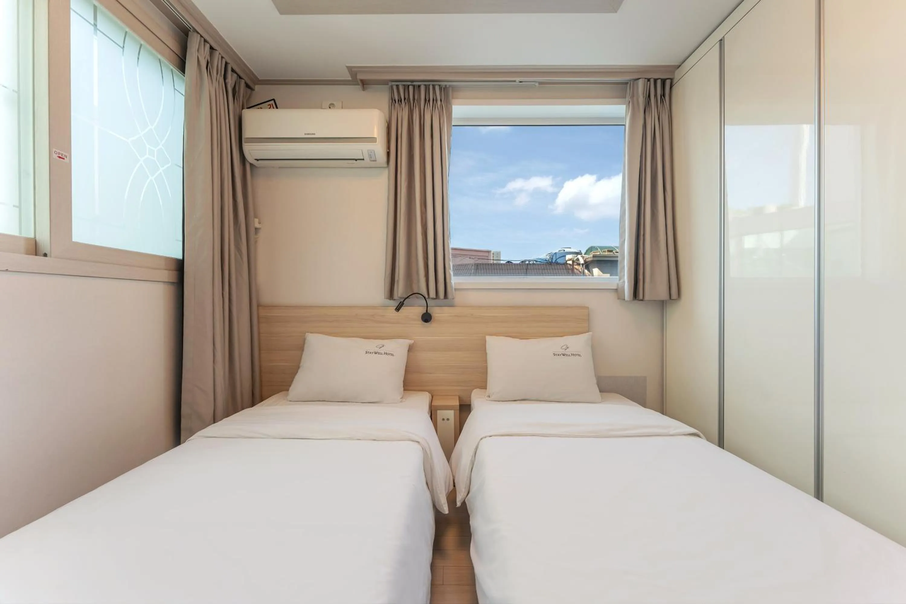 Bed in Staywell Hotel