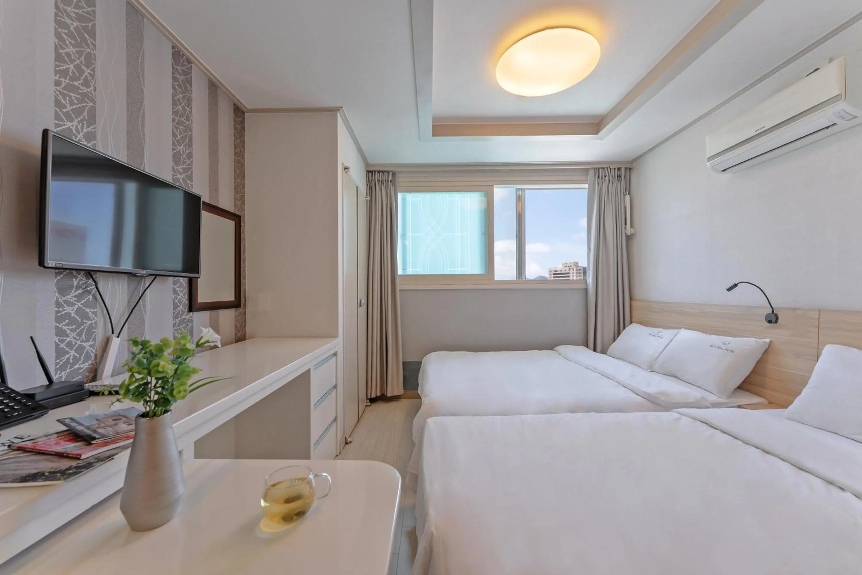 Bed in Staywell Hotel