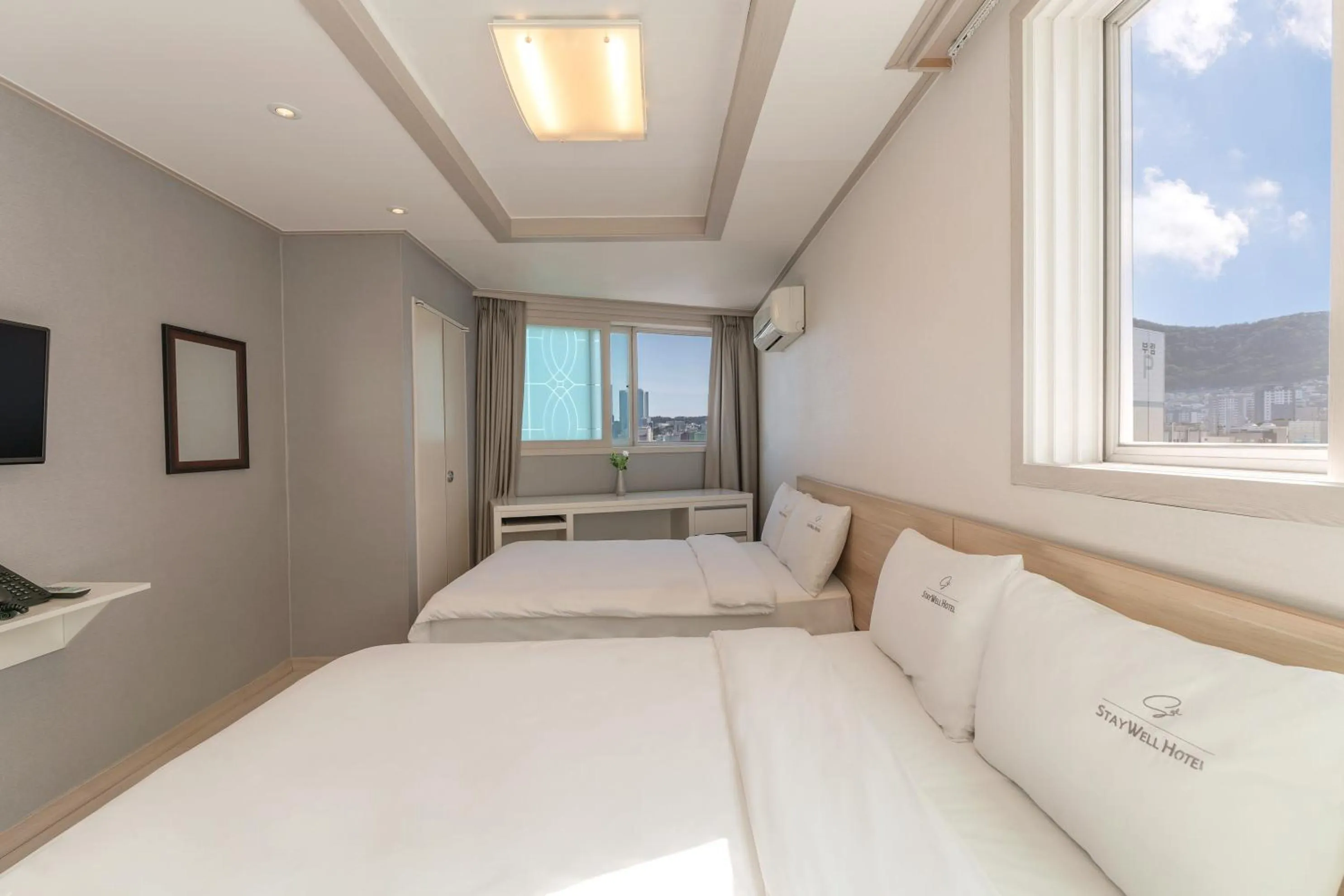 Bed in Staywell Hotel