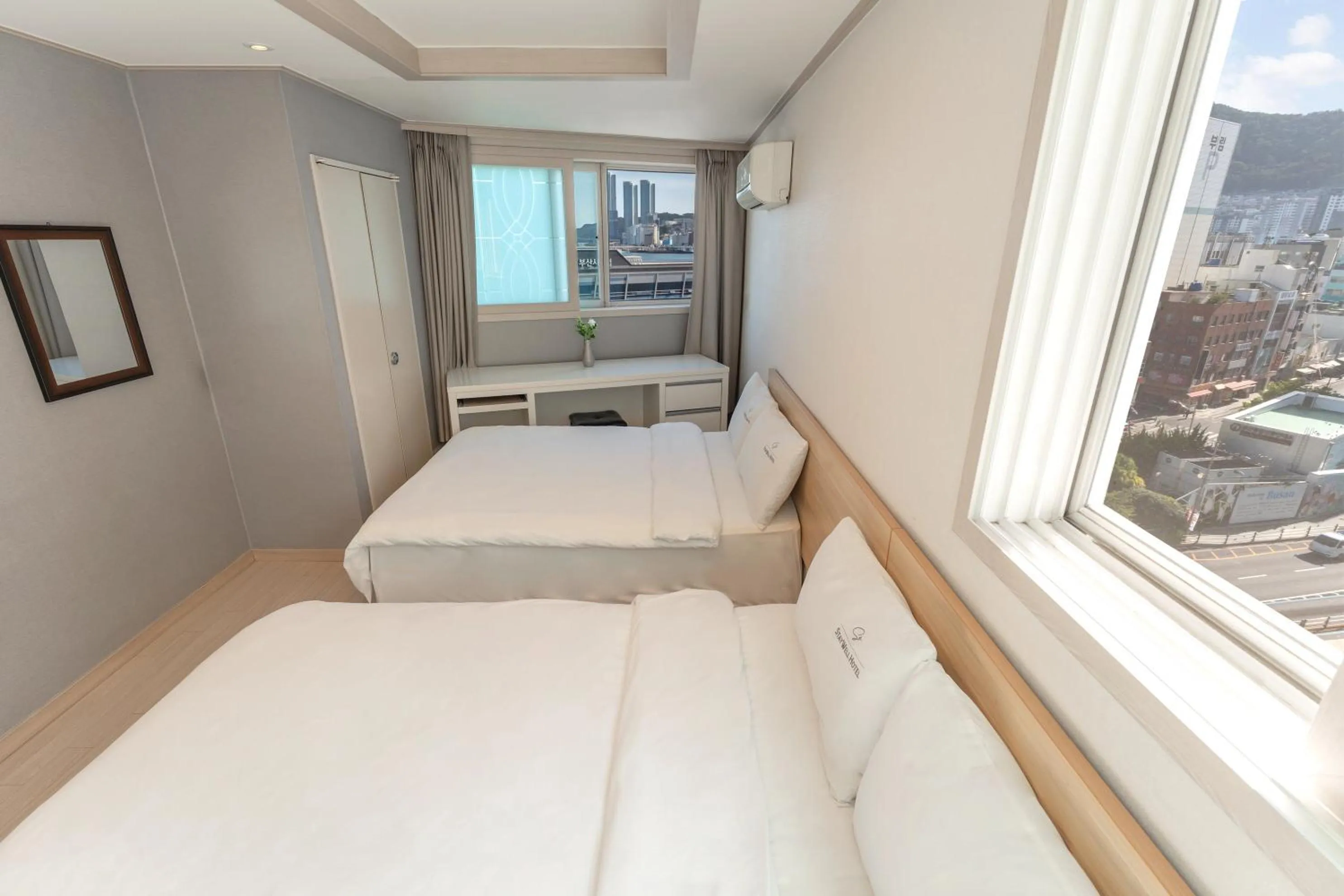 Bed in Staywell Hotel