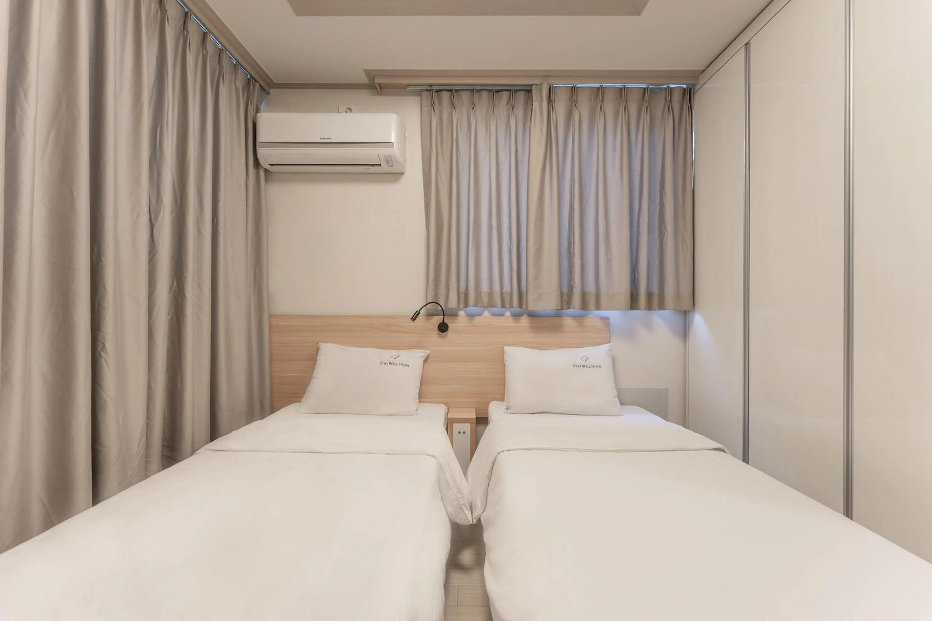 Bed in Staywell Hotel