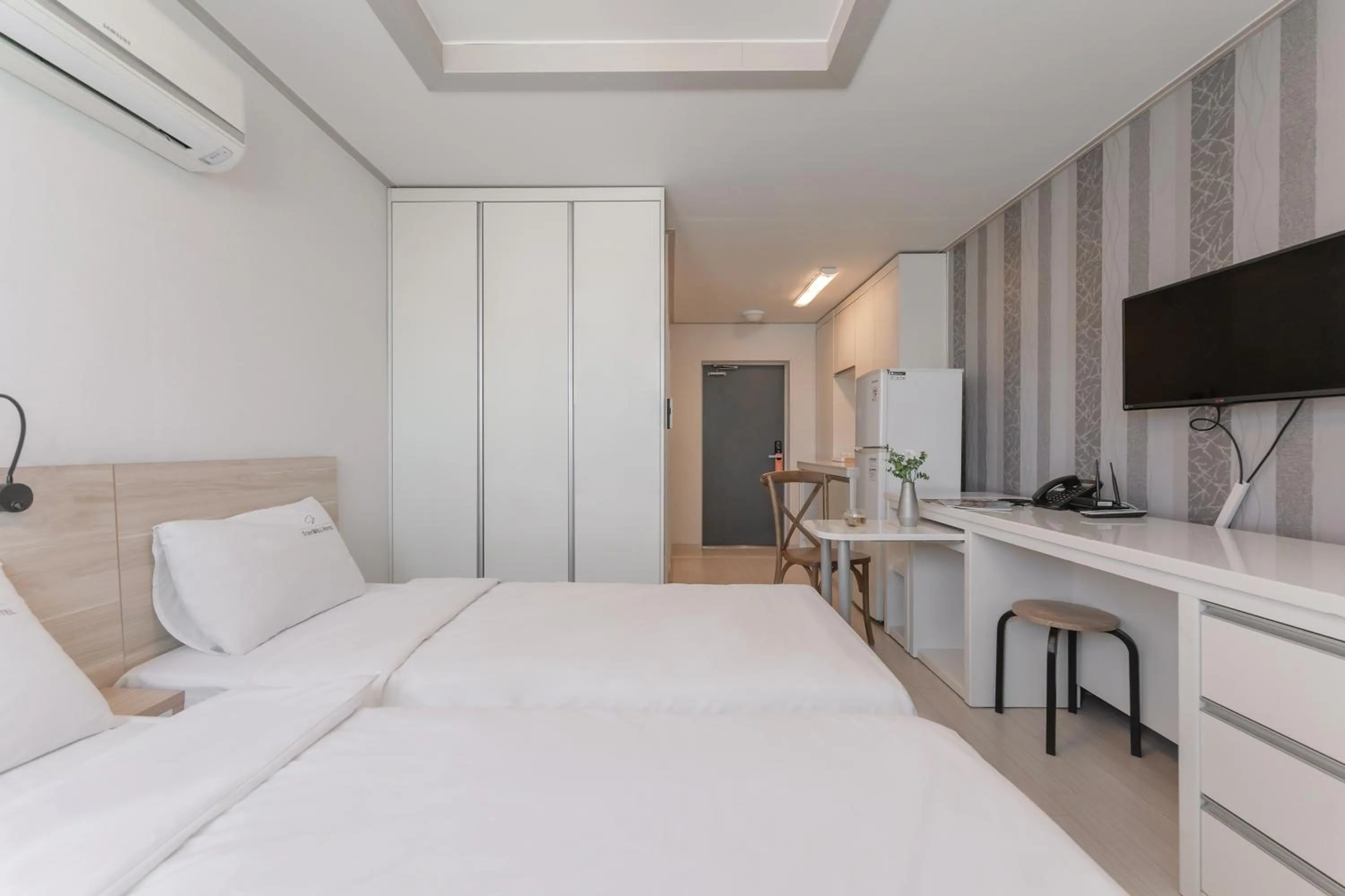 Bed in Staywell Hotel