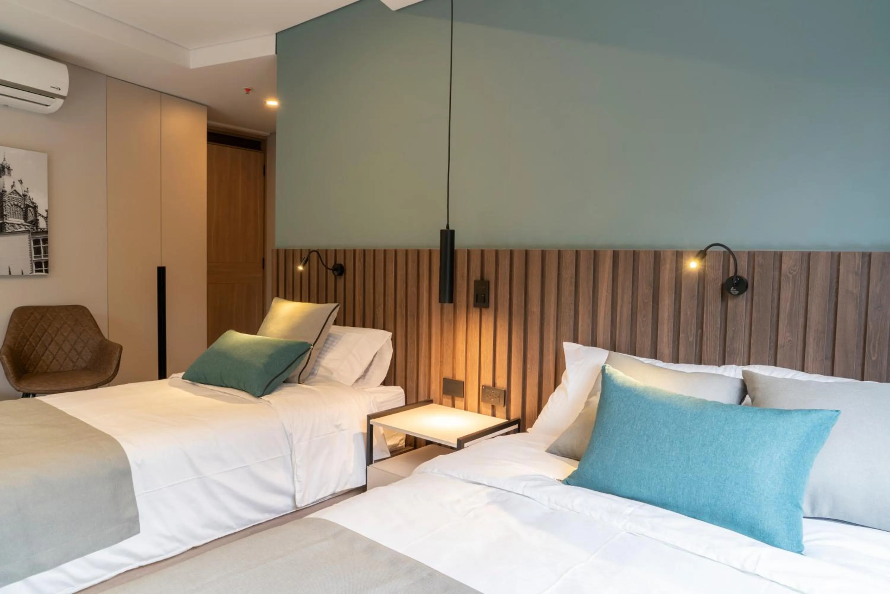 Bed in Hotel Living 35 Suites