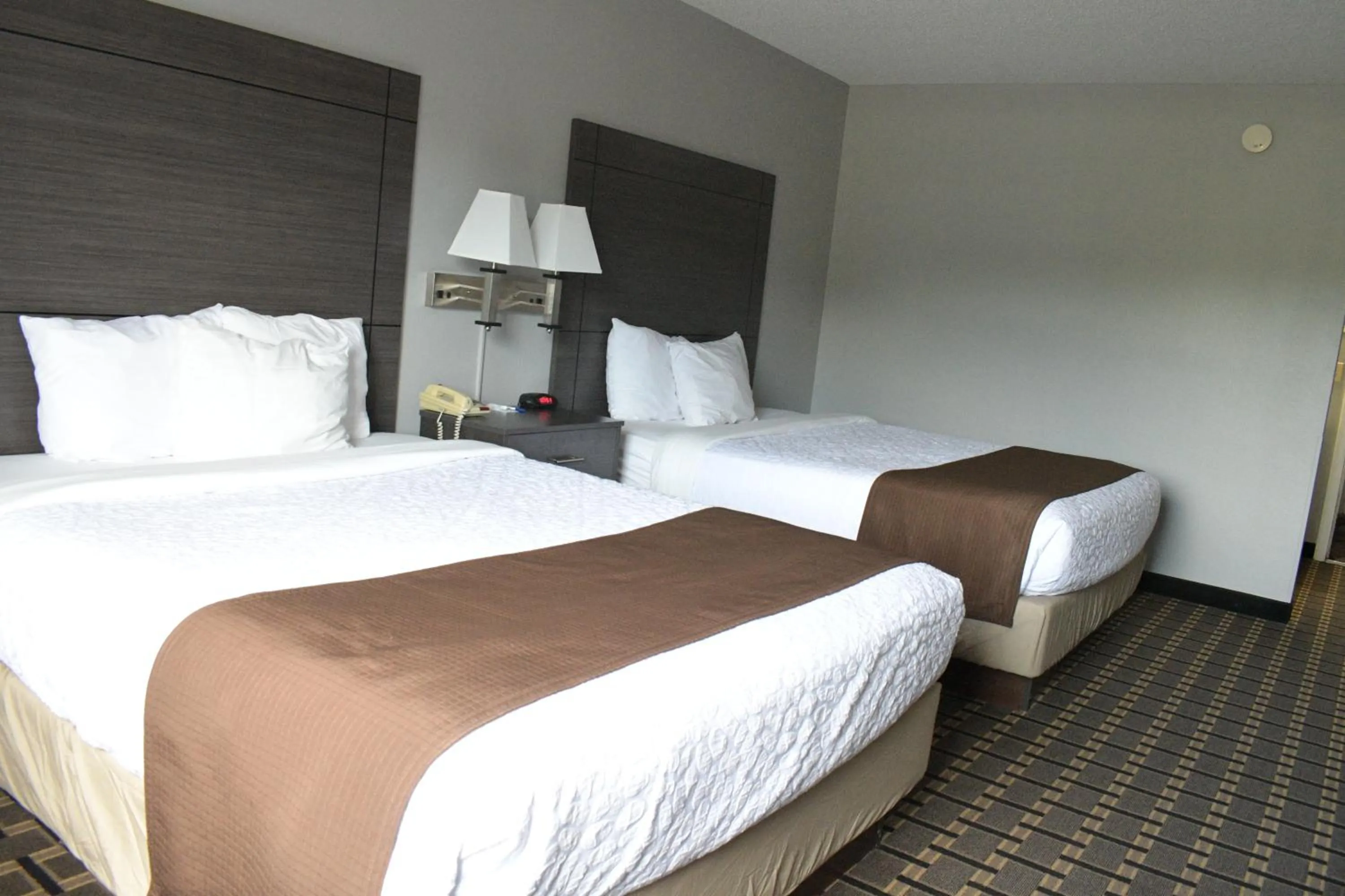 Bed in Adams Inn and Suites