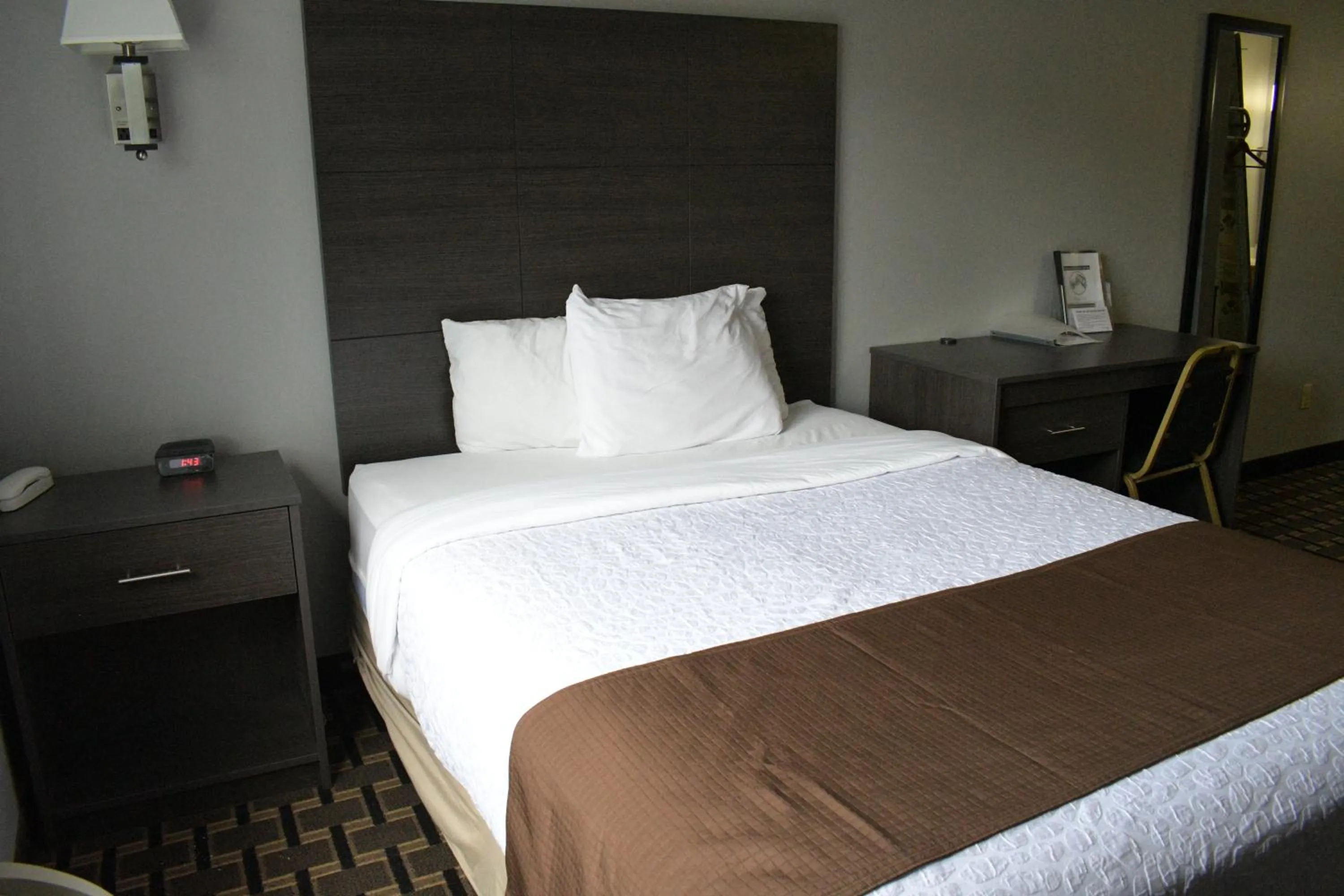 Bed in Adams Inn and Suites