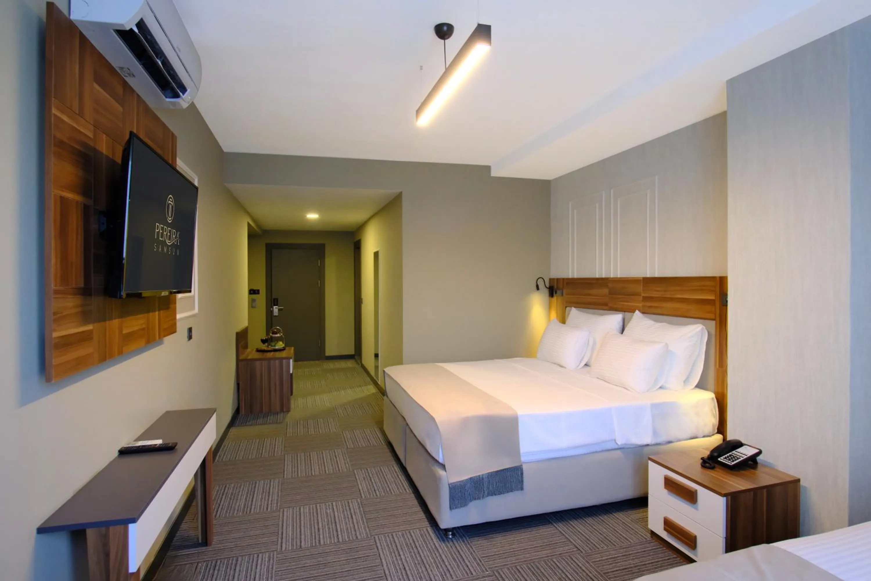 Communal lounge/ TV room, Bed in Pereira Samsun