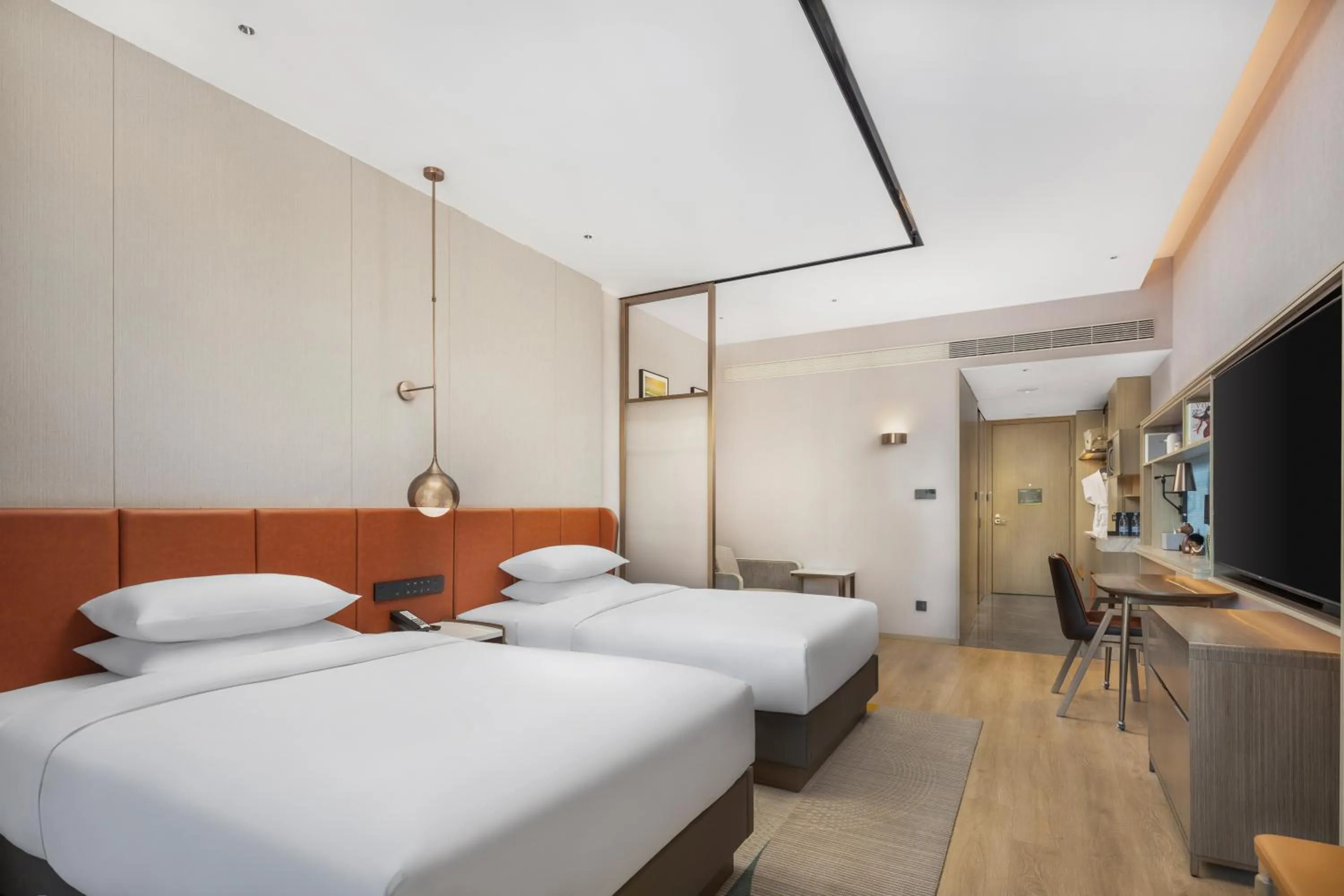 Photo of the whole room in Home2 by Hilton Xinjiang Kuche