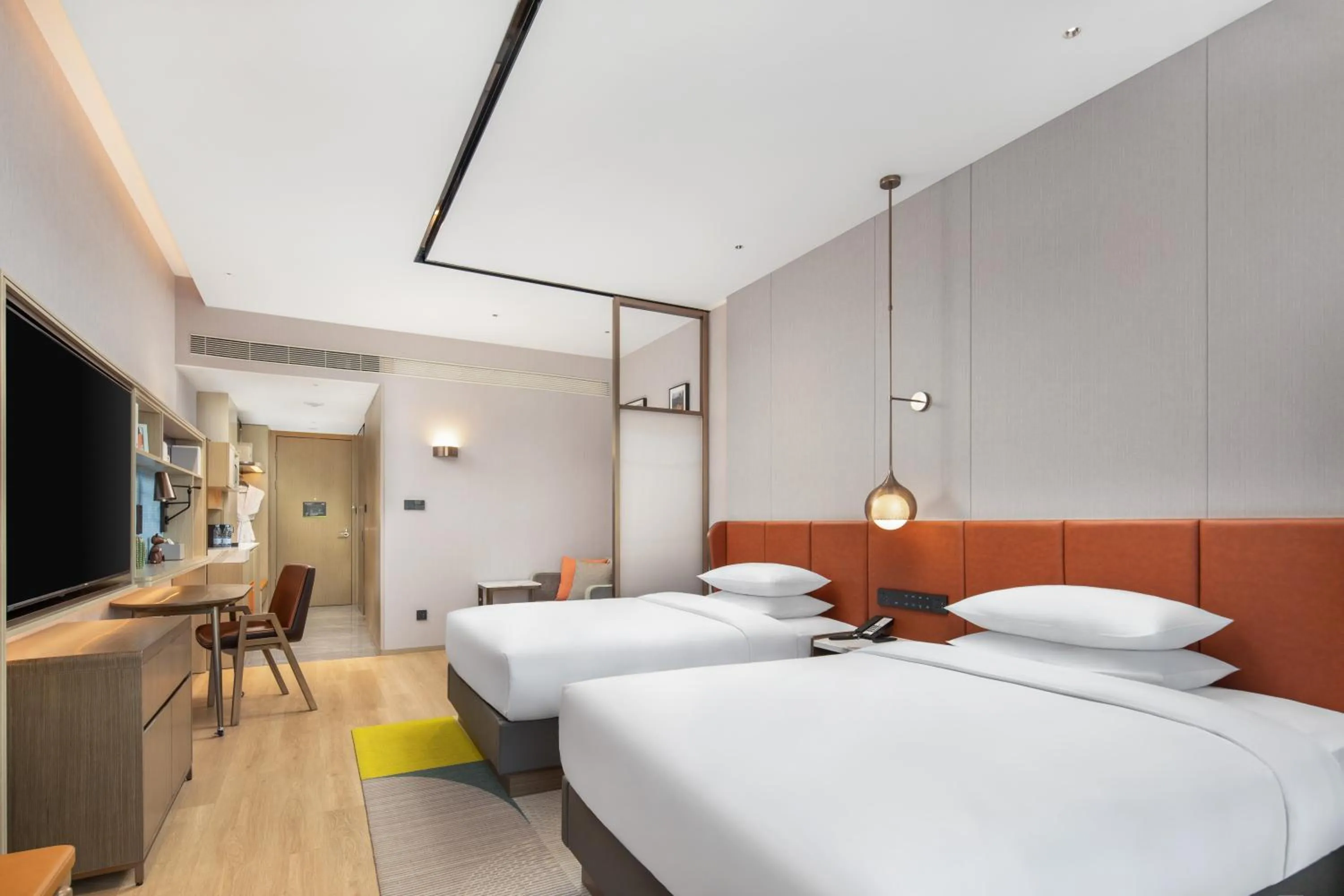 Photo of the whole room in Home2 by Hilton Xinjiang Kuche