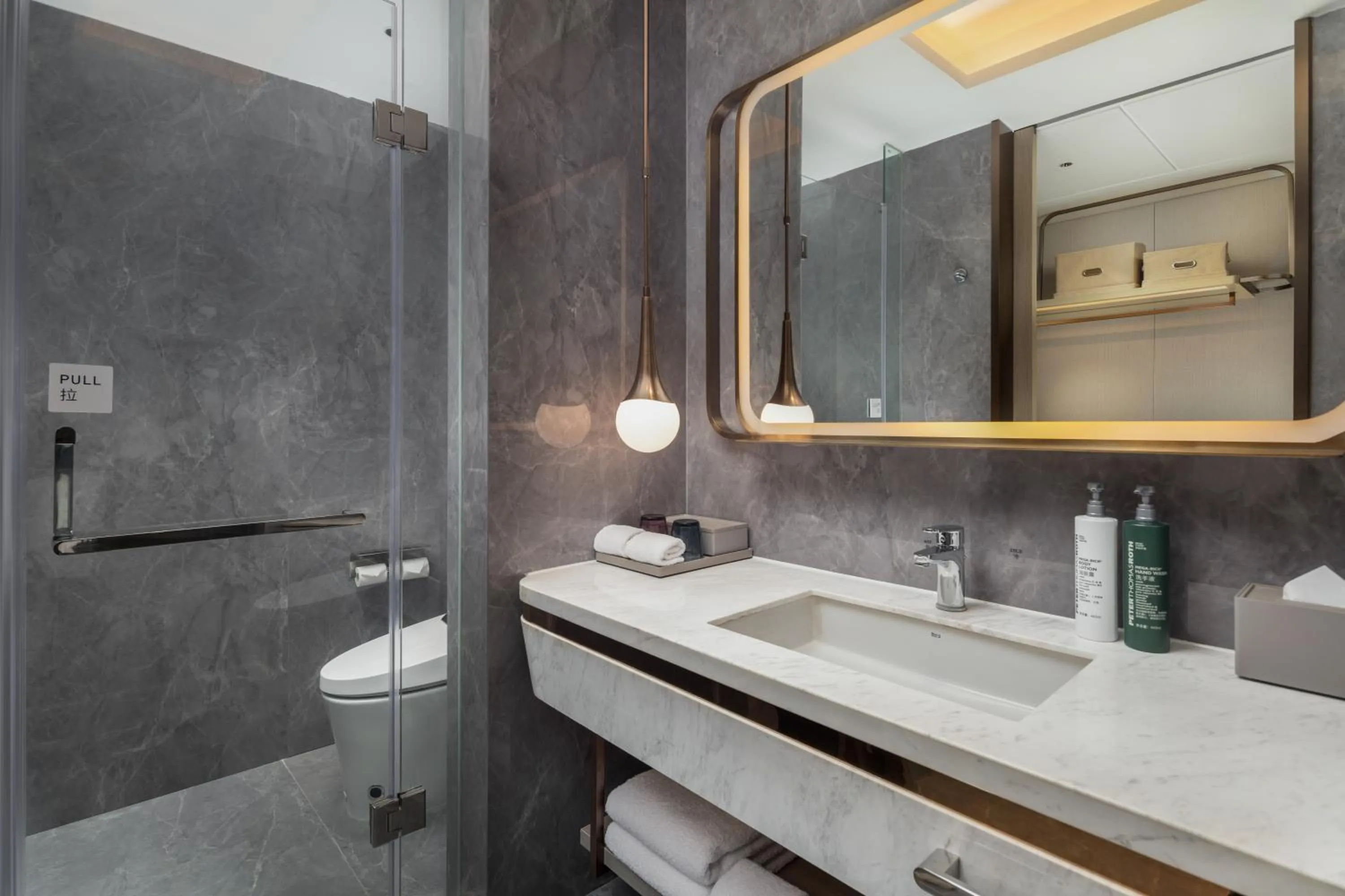 Toilet in Home2 by Hilton Xinjiang Kuche