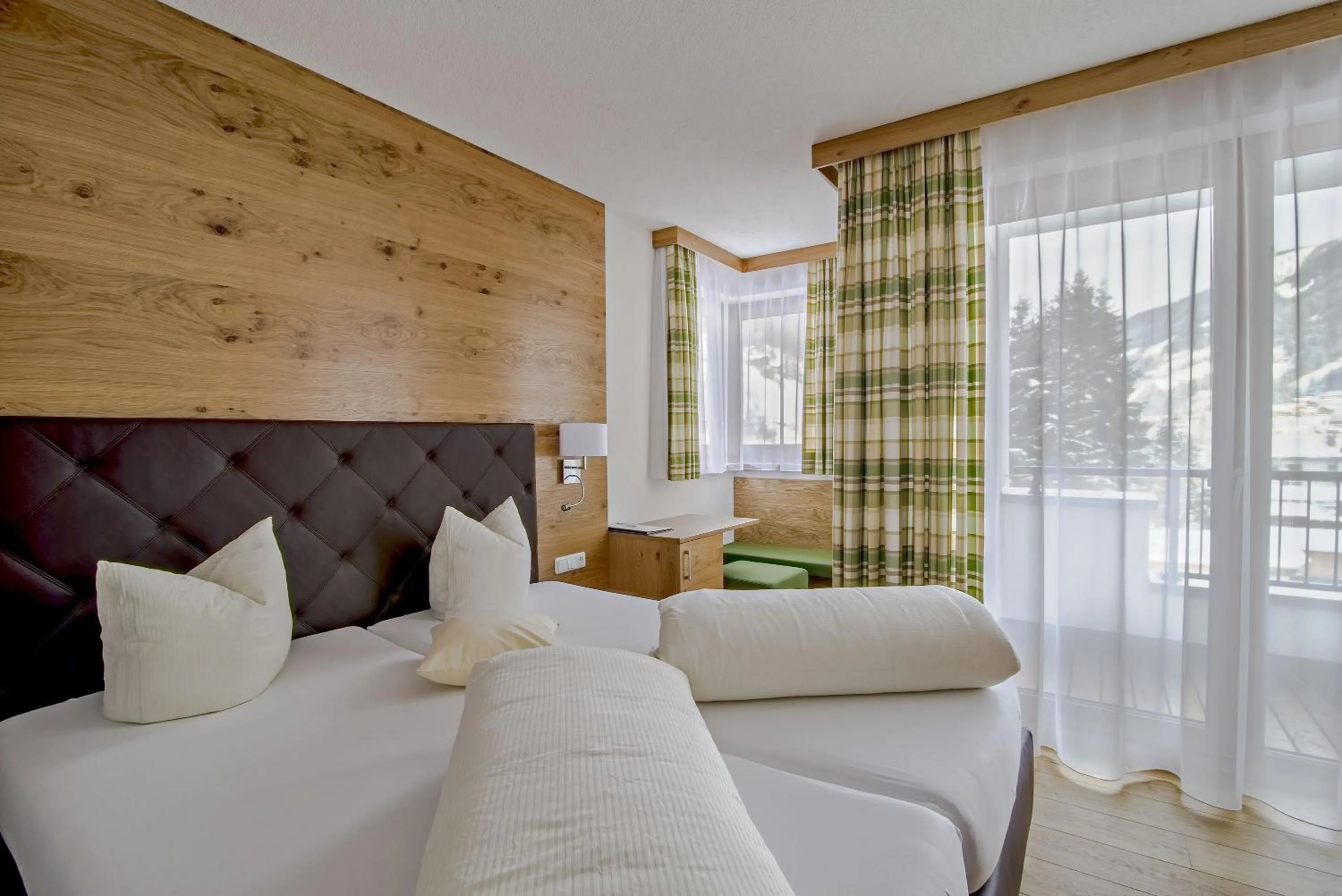 Photo of the whole room, Bed in Hotel Enzian Paznaun